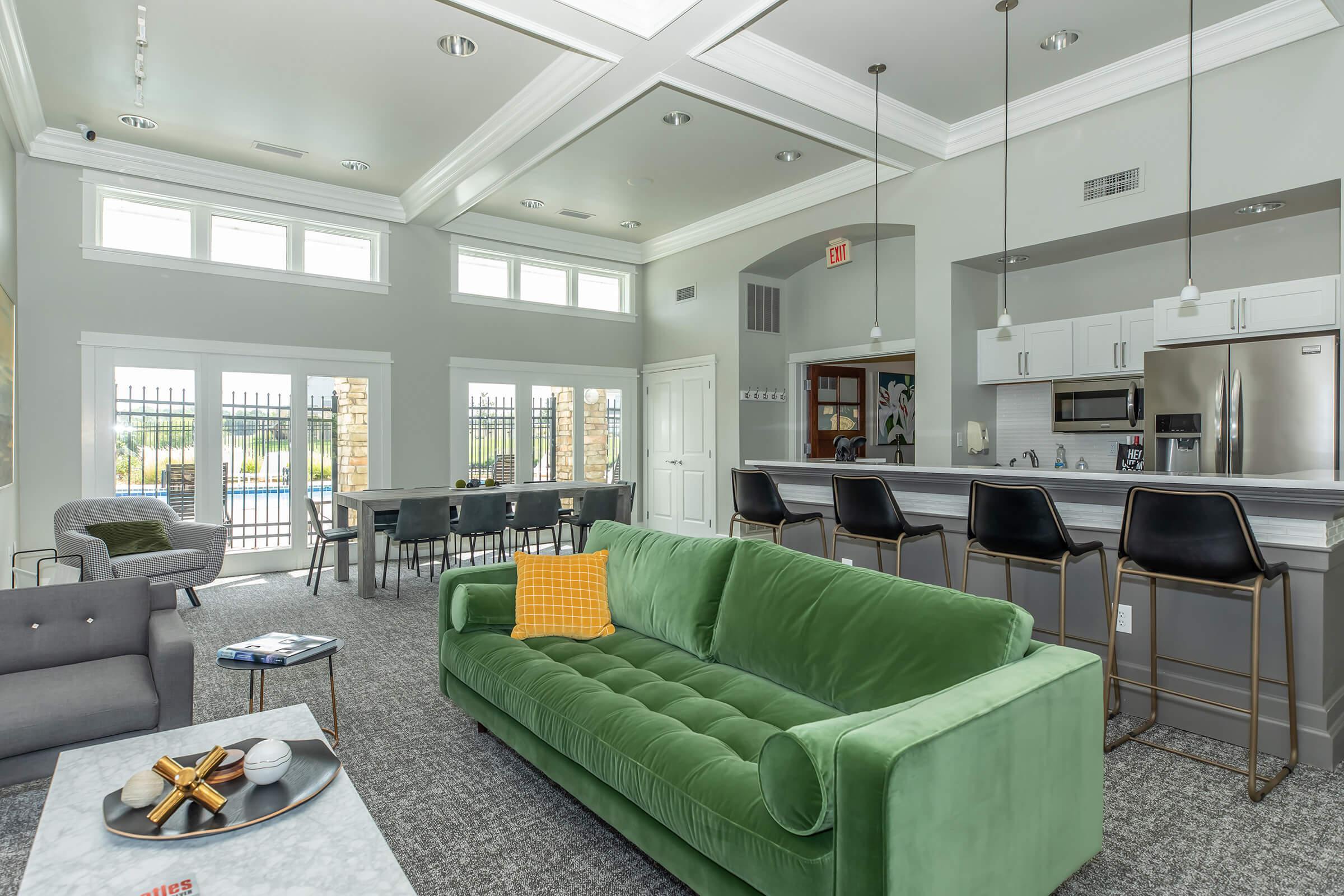 a living room filled with furniture and a large window