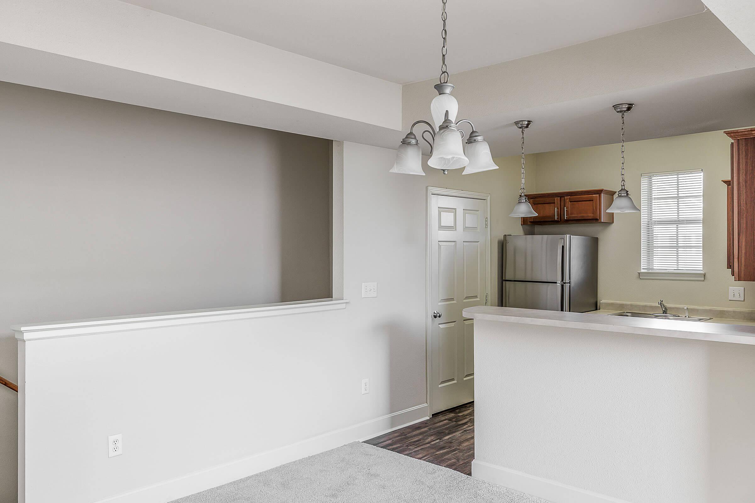 a kitchen with a sink and a mirror