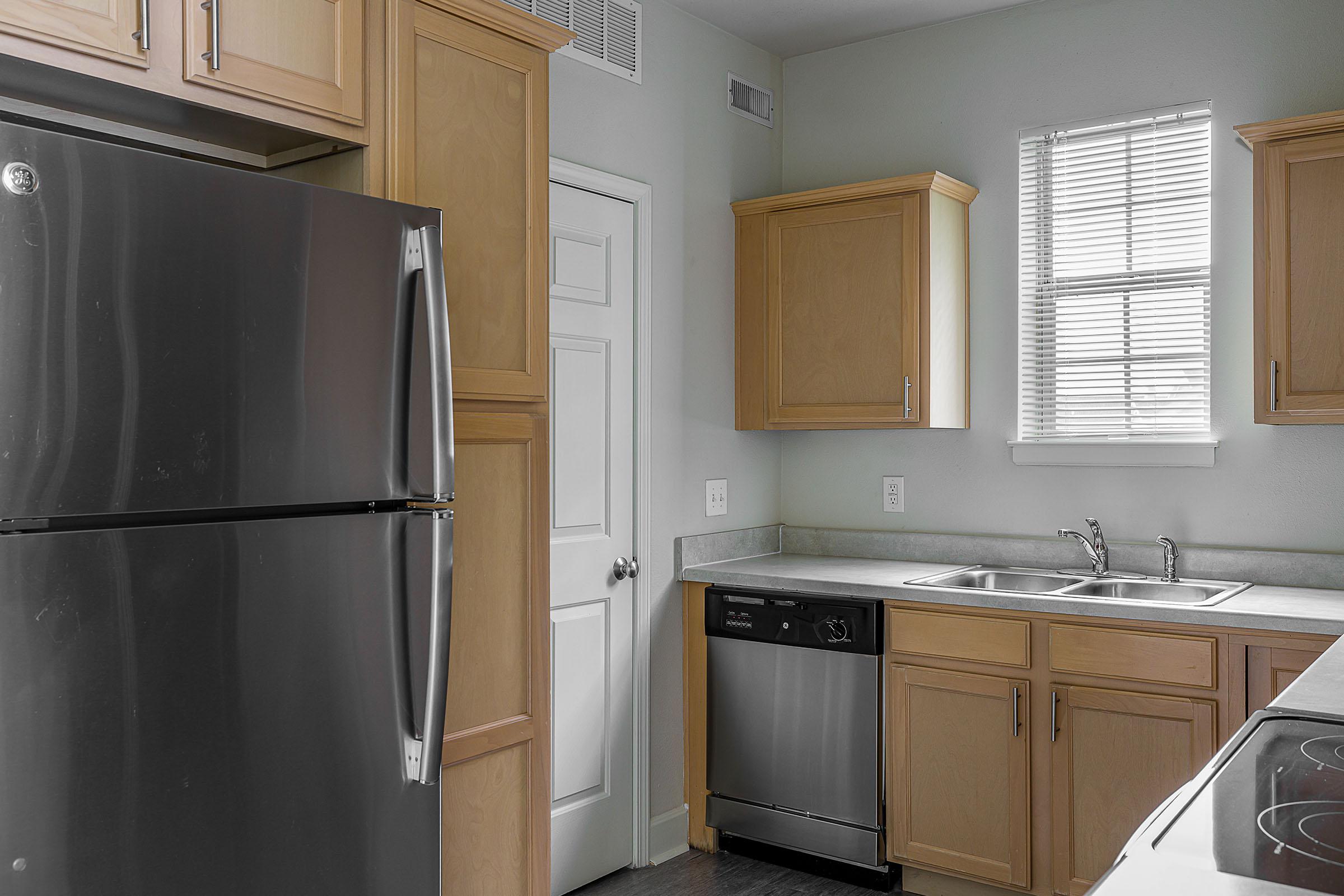 a kitchen with a stove top oven sitting inside of a refrigerator