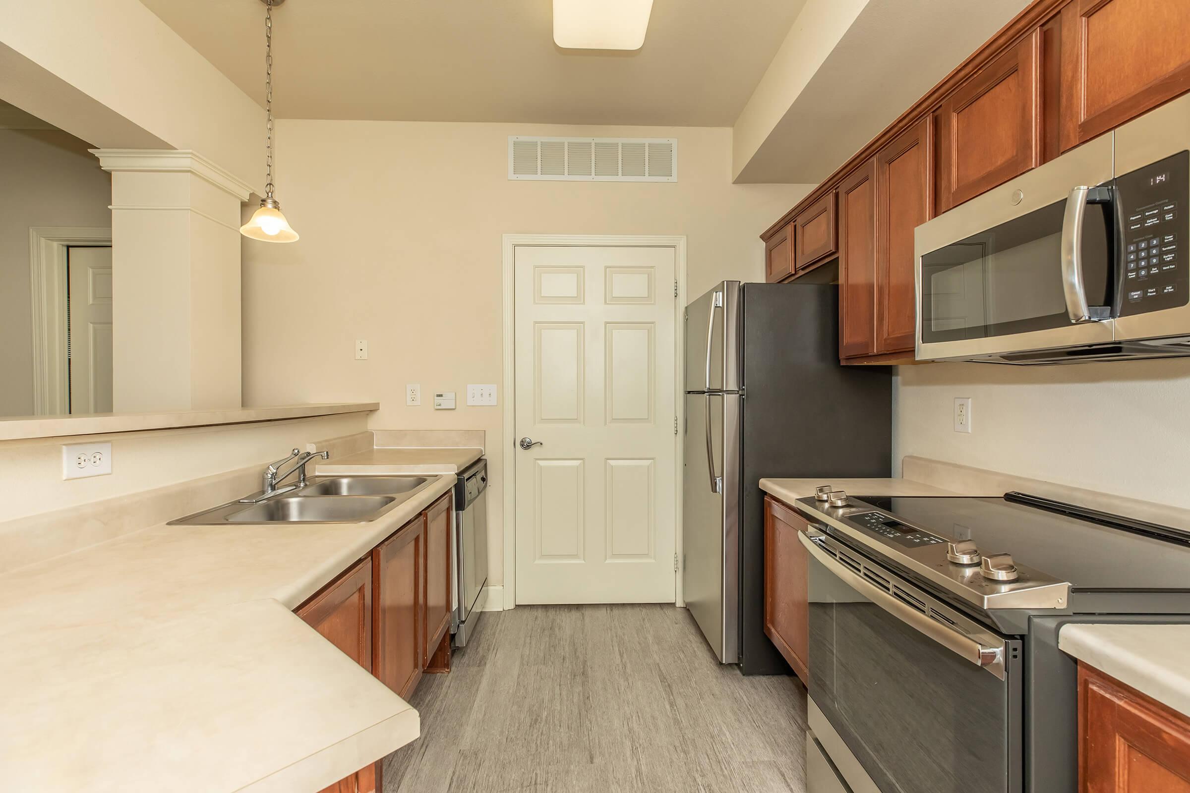 a kitchen with a stove and a sink