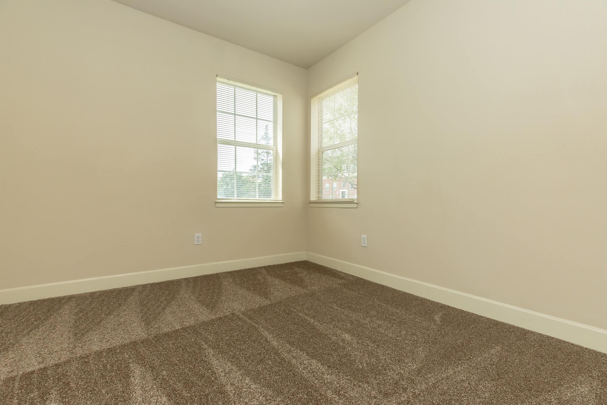 a bedroom with a large window