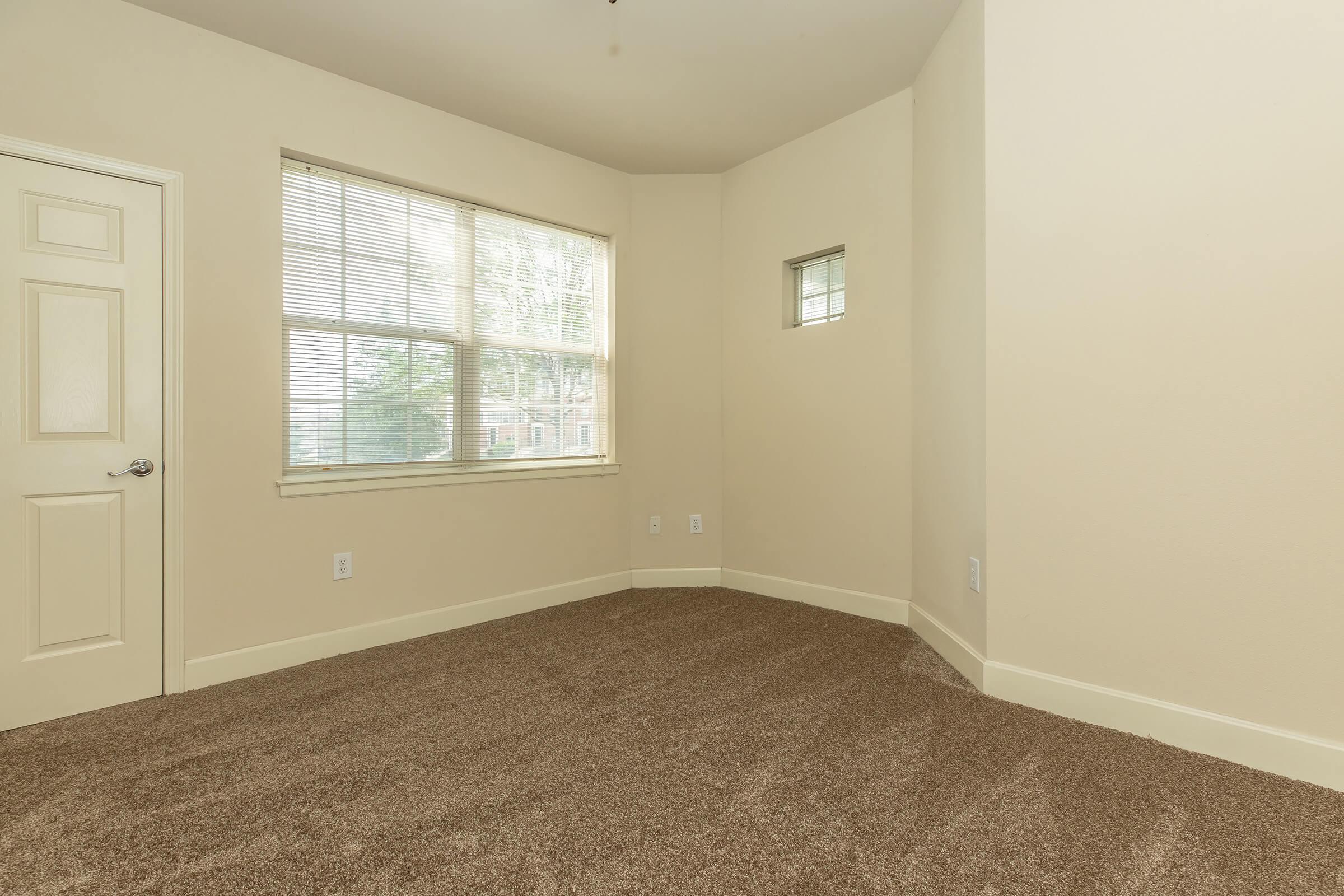 a bedroom with a large window