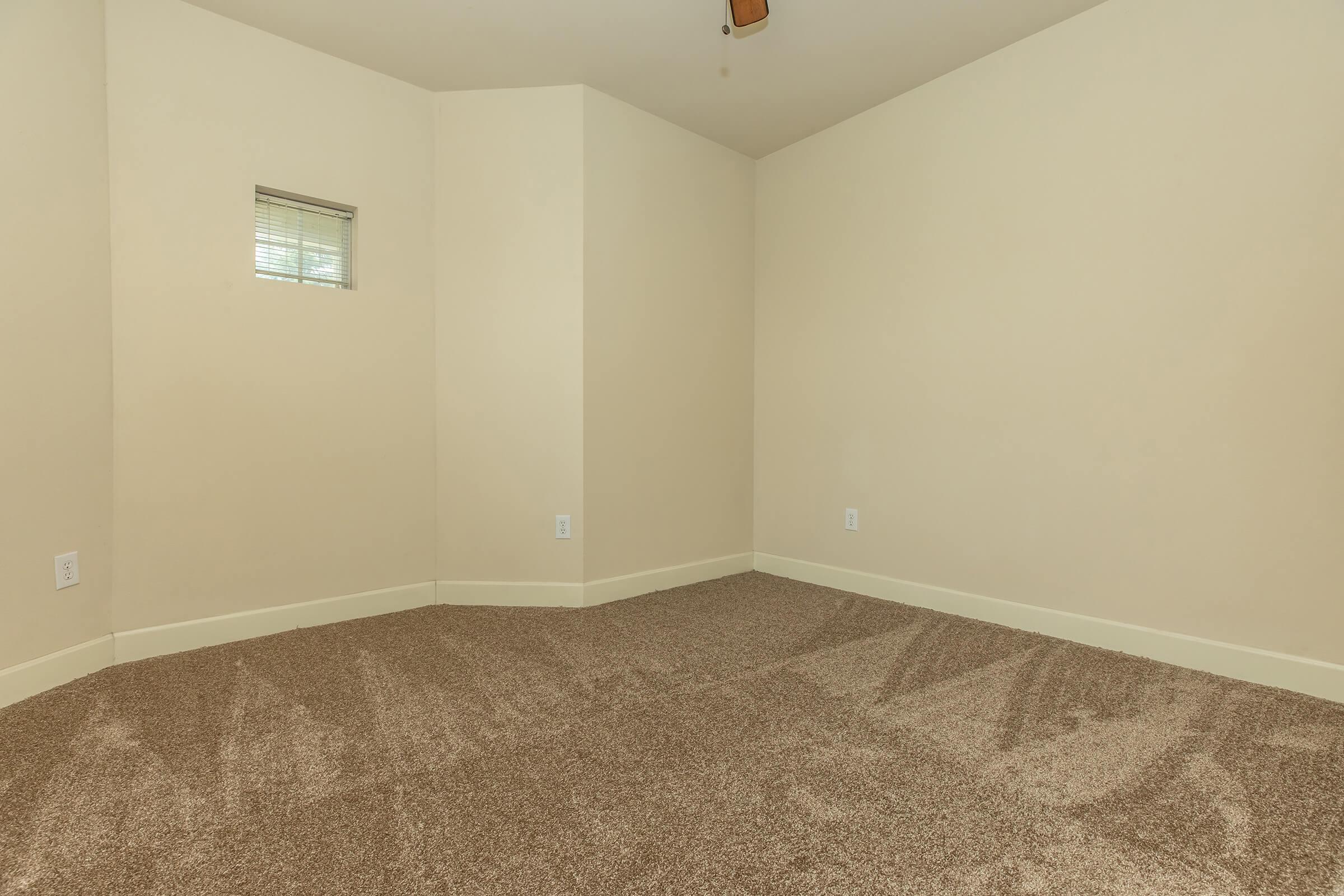 a bedroom with a large mirror