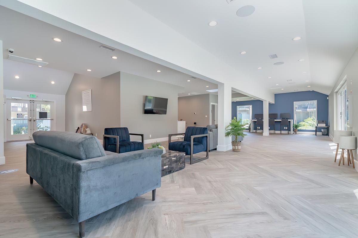 a living room filled with furniture and a flat screen tv