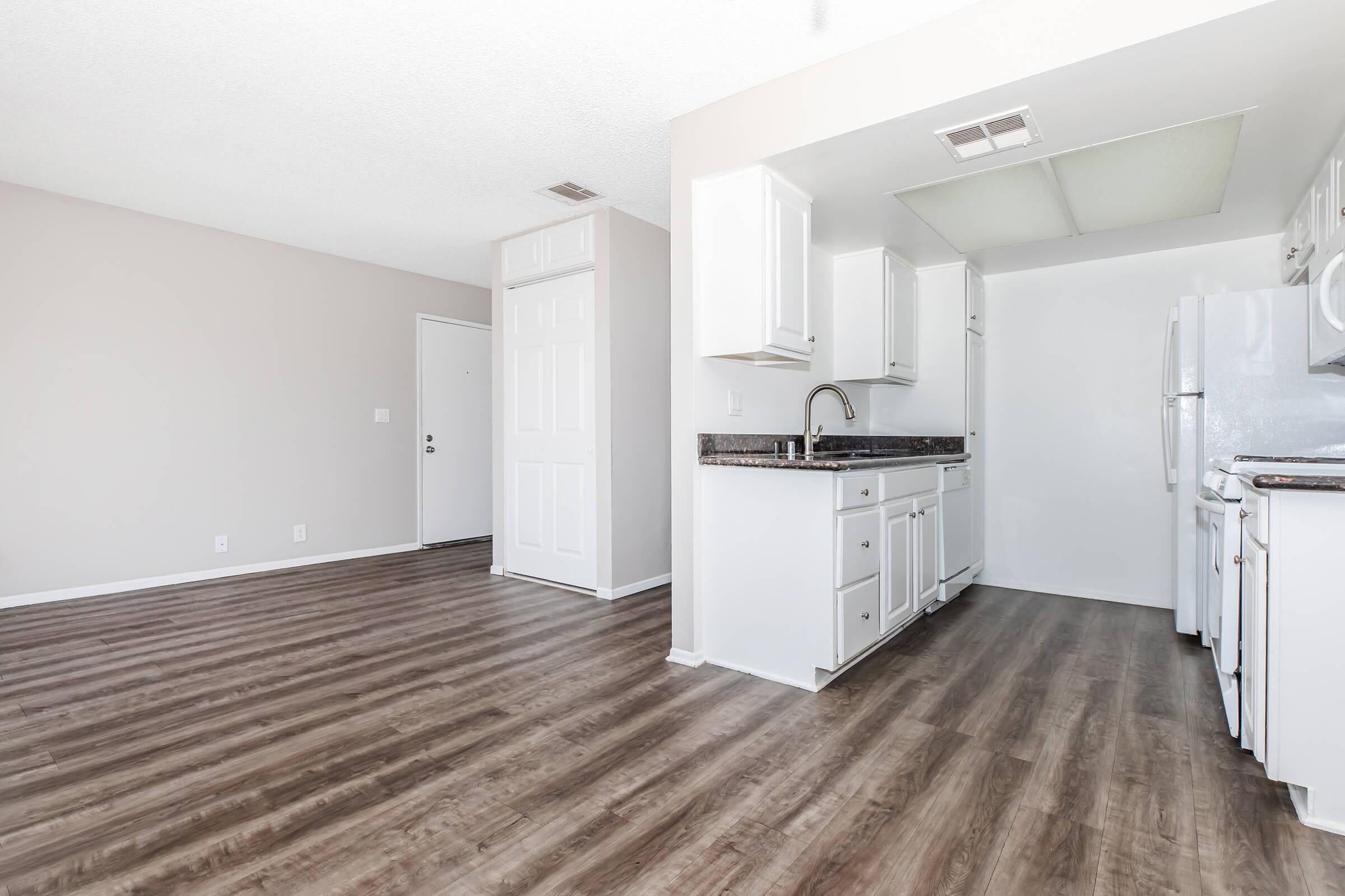 a kitchen with a wood floor