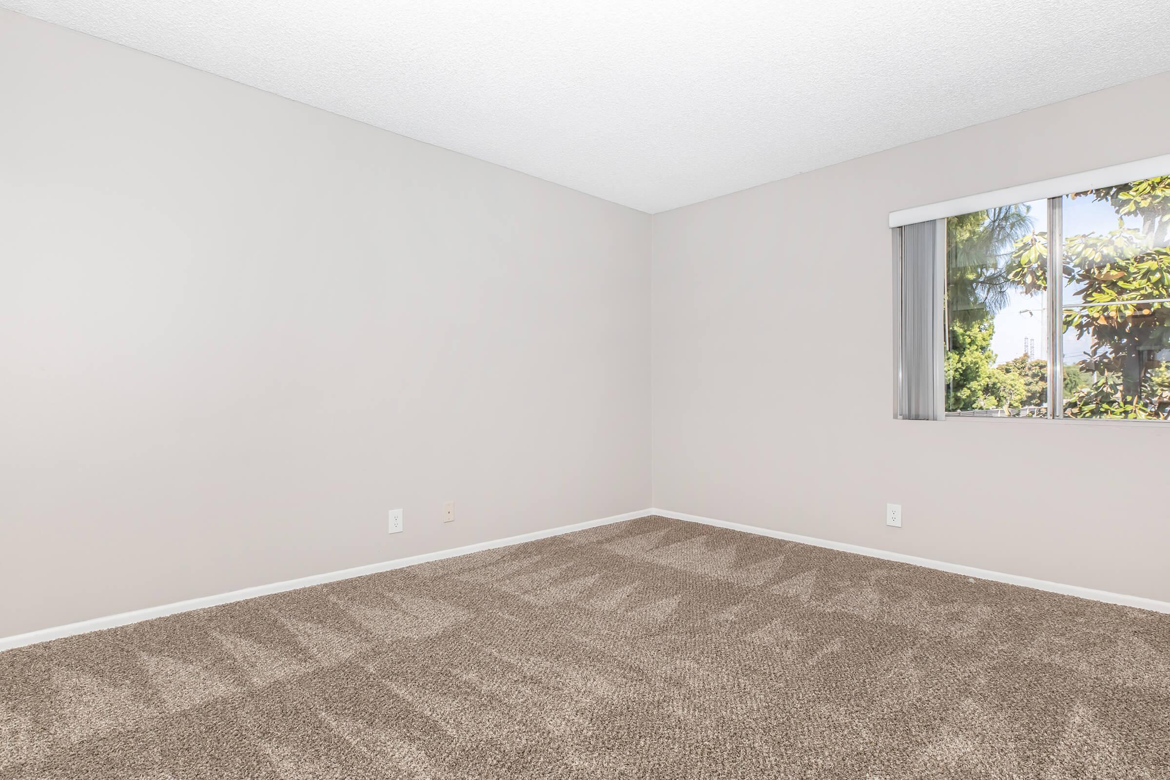 a view of a bedroom next to a window