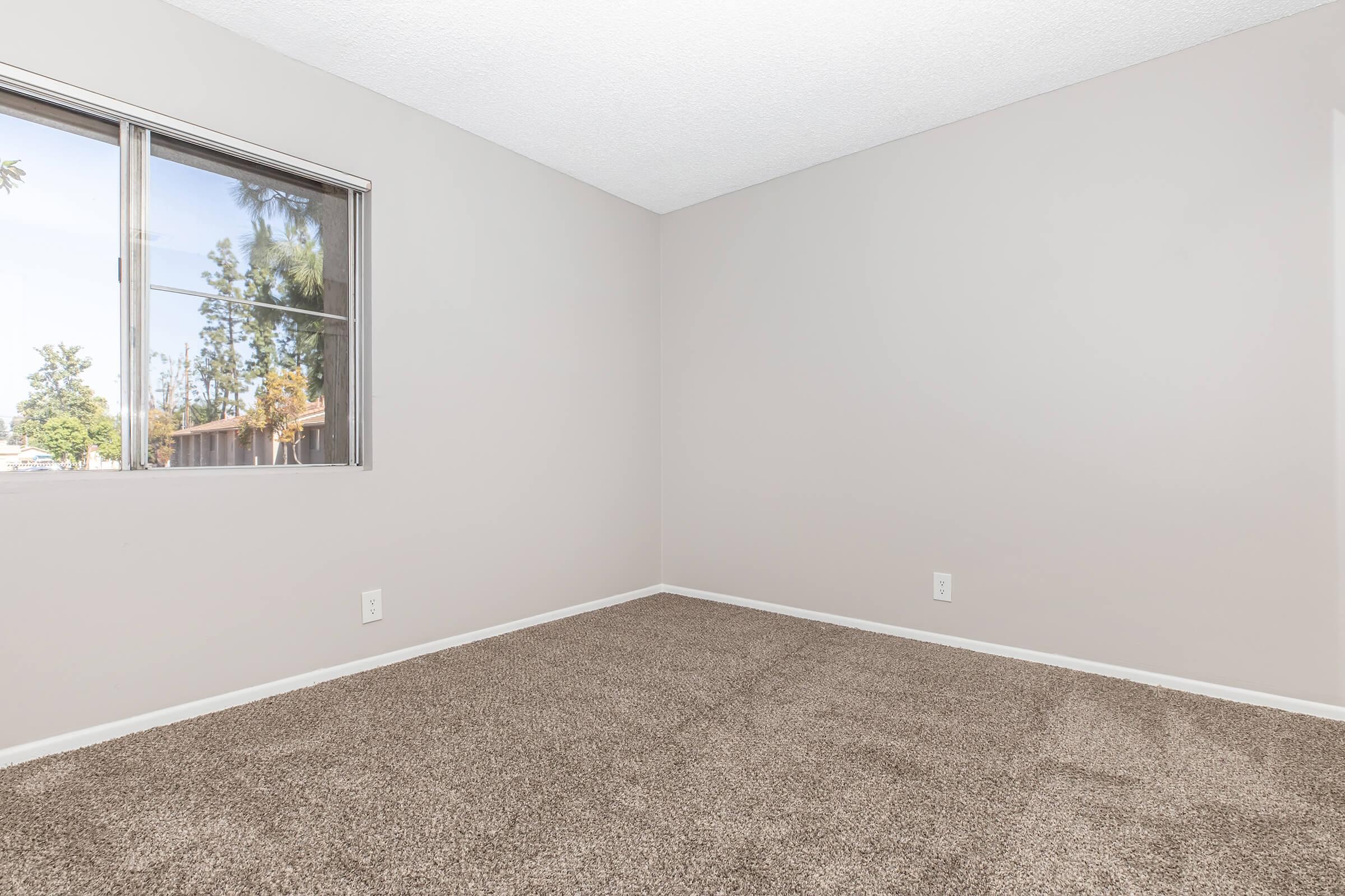 a view of a bedroom next to a window