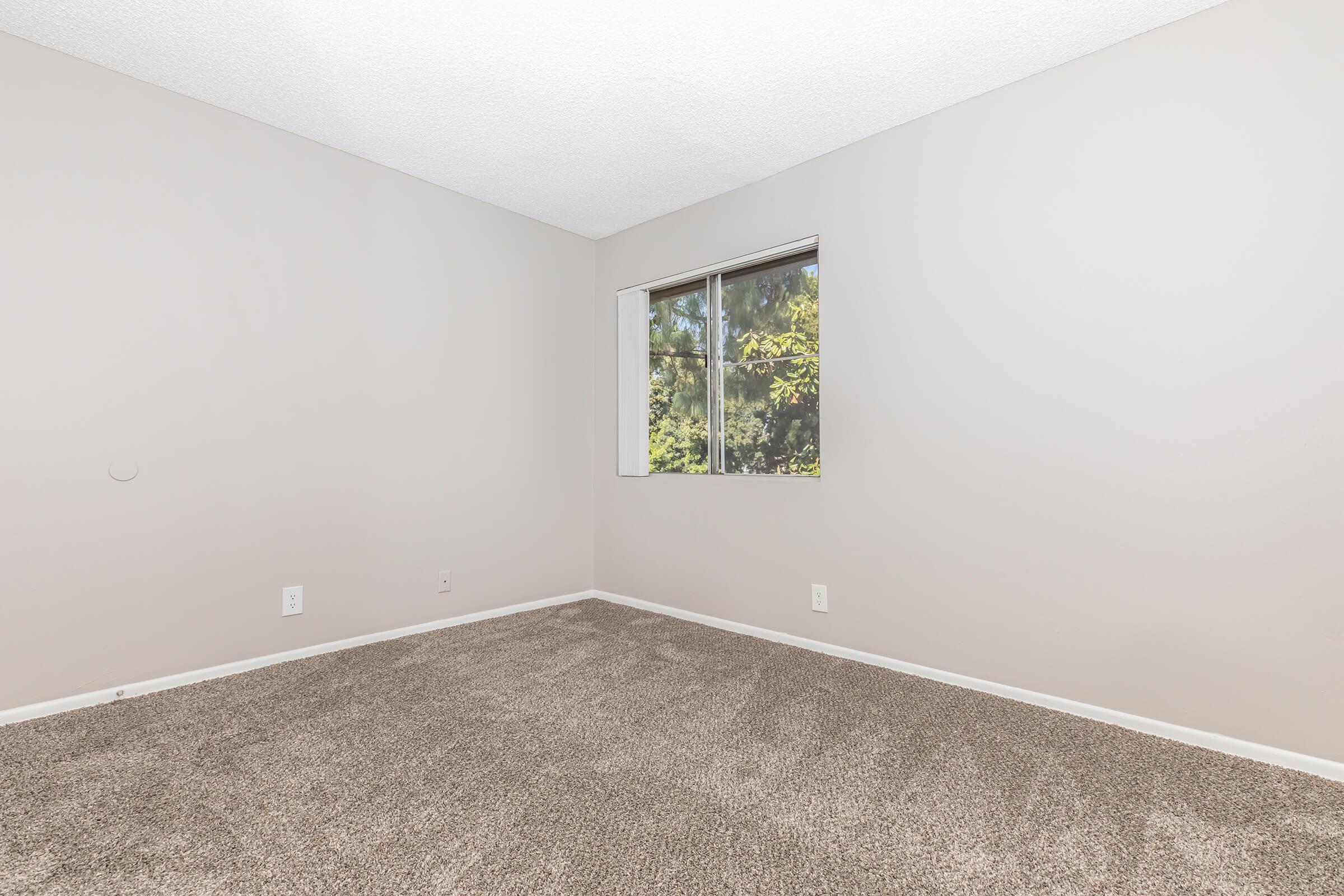 a bedroom with a large mirror