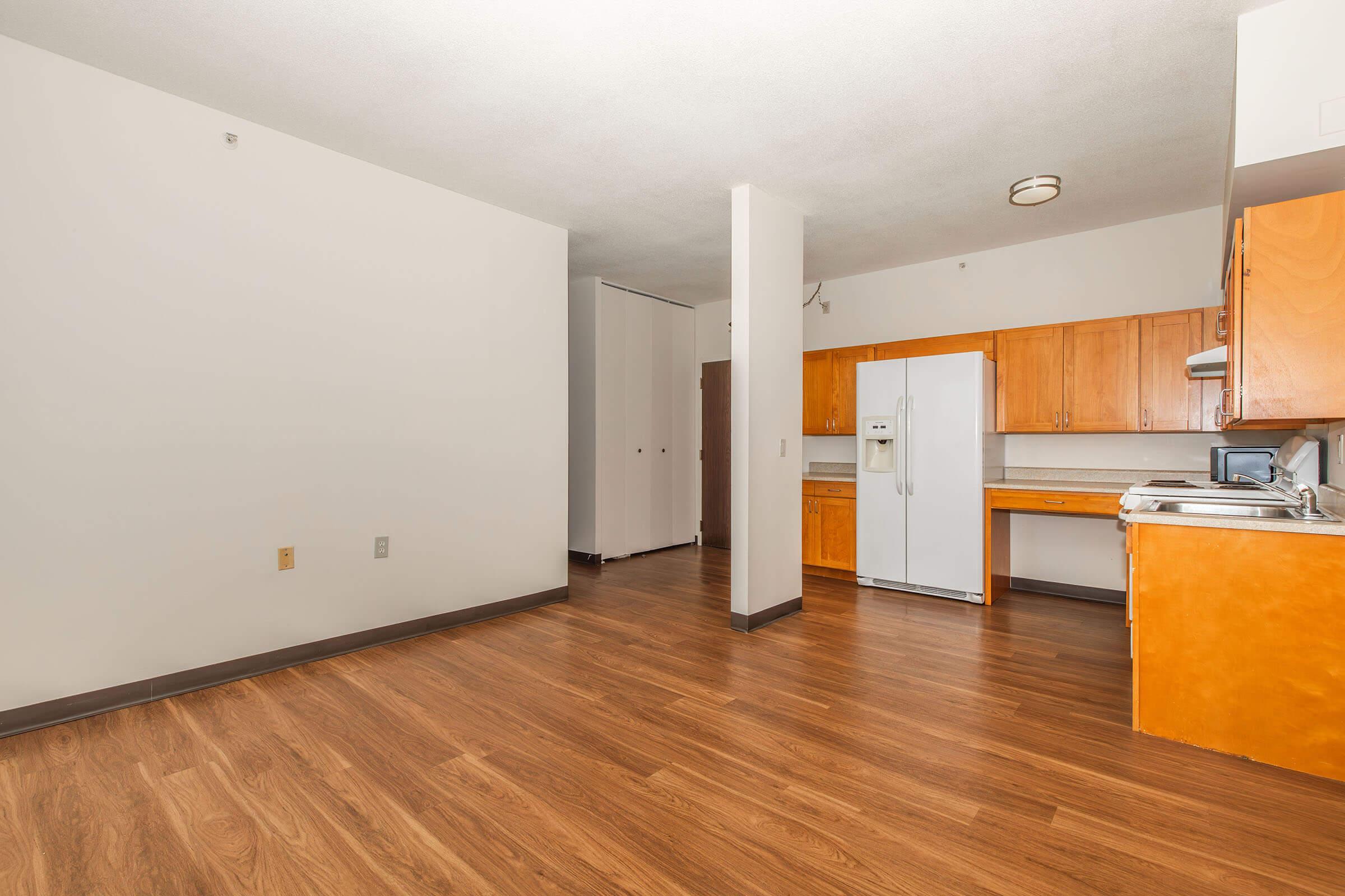 a kitchen with a wood floor