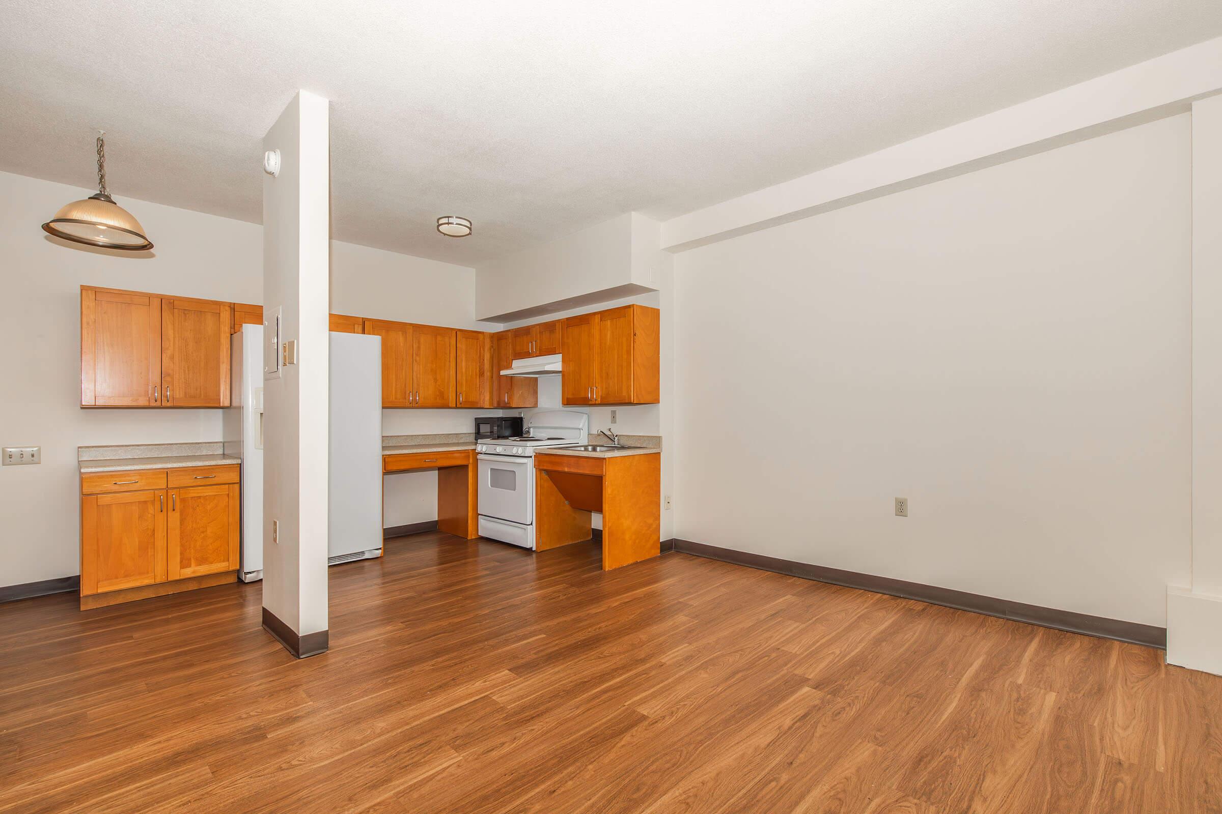 a kitchen with a wood floor