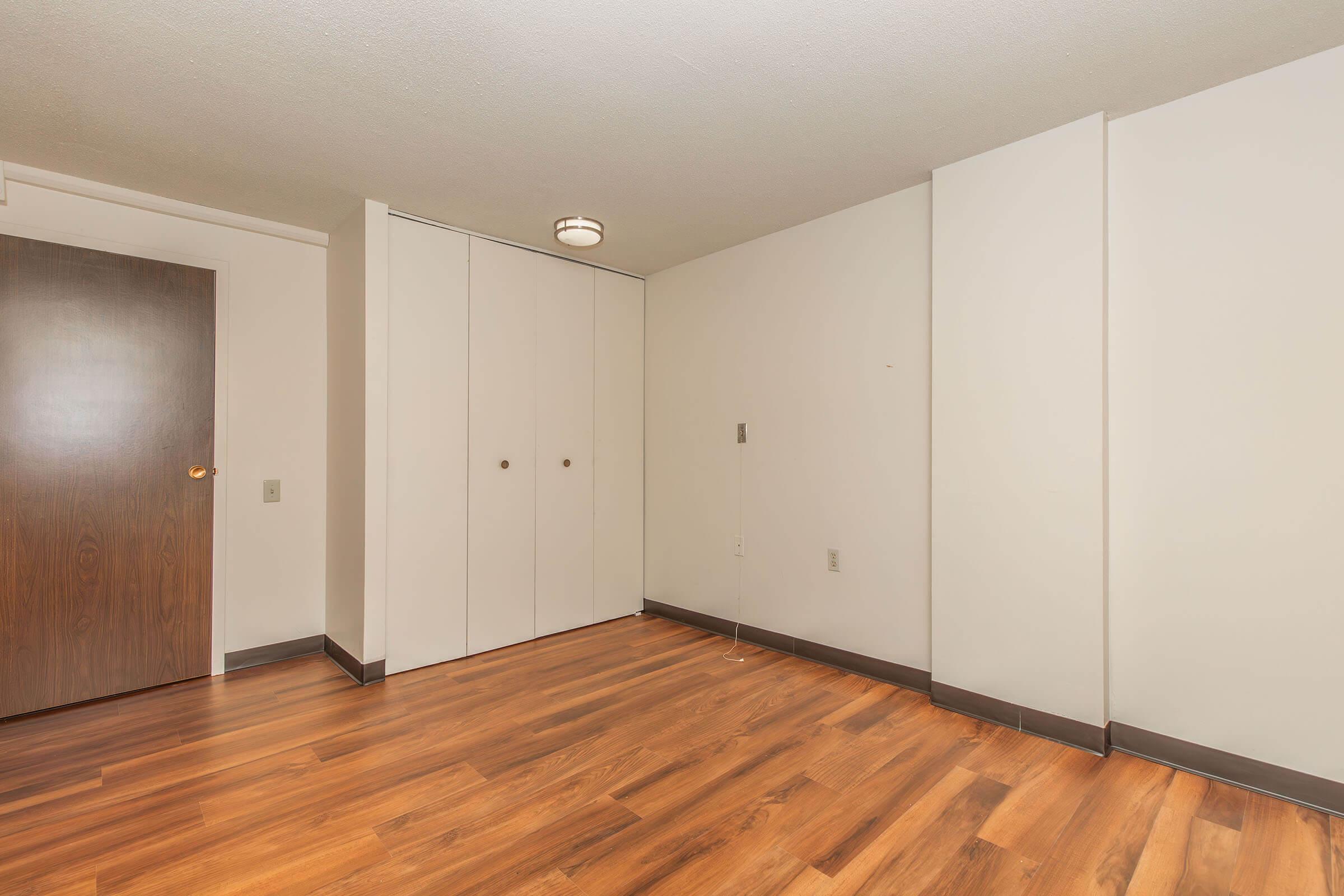 a kitchen with a wood floor