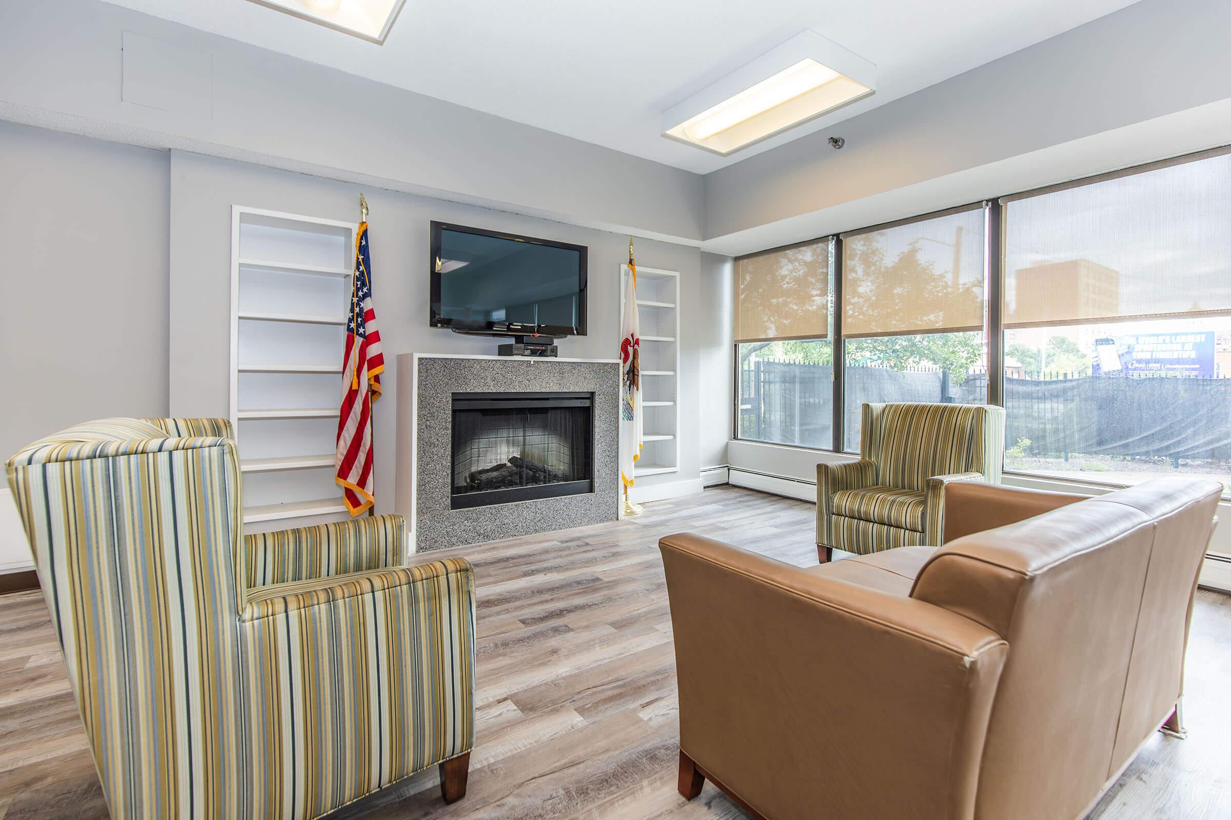 a living room filled with furniture and a fireplace