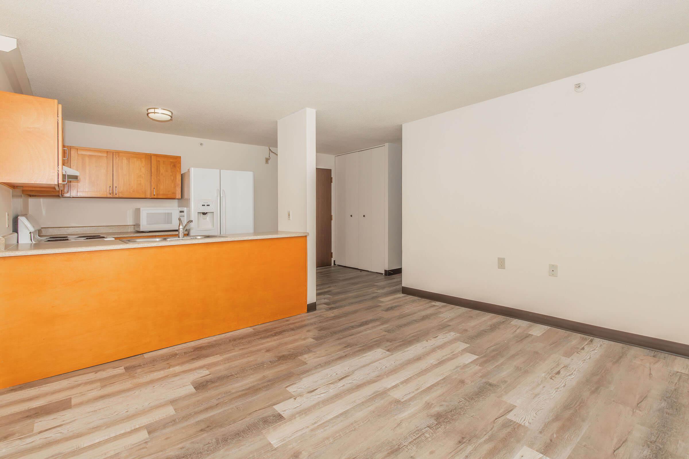 a kitchen with a wood floor