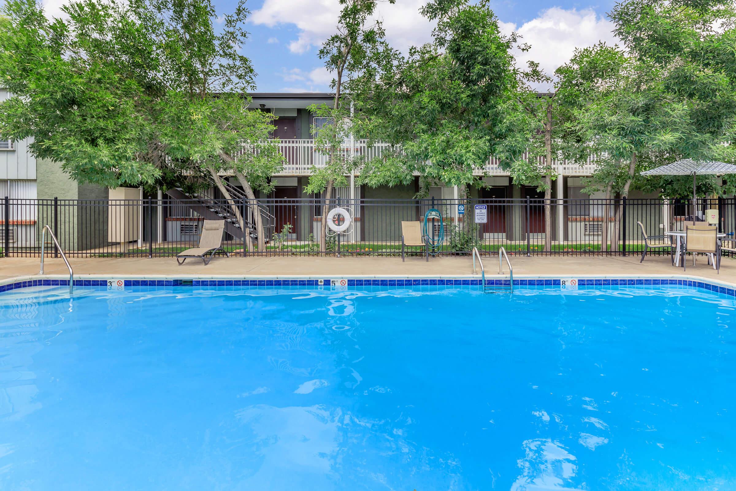 a blue frisbee sitting on top of a swimming pool