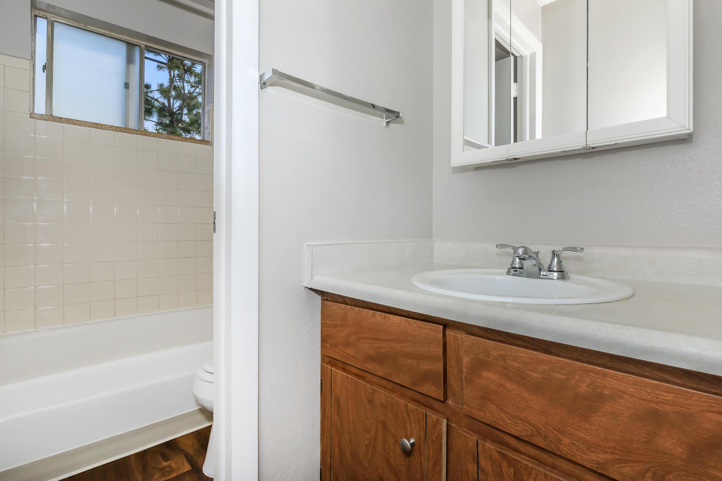 a room with a sink and a mirror