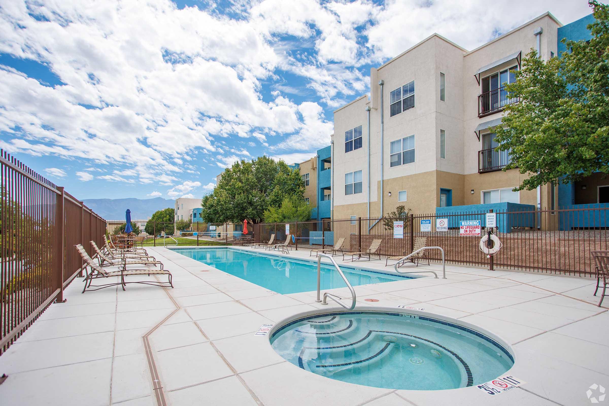 a pool next to a fence