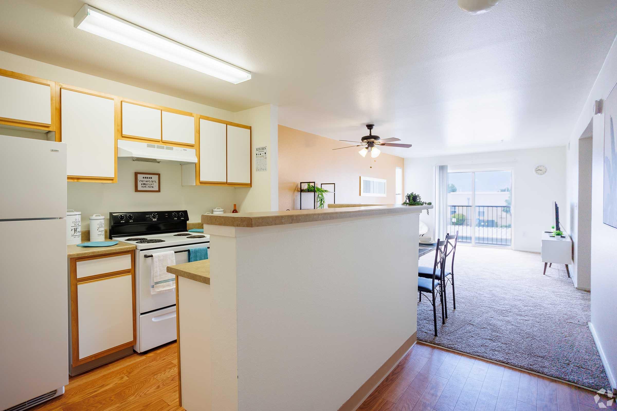 a kitchen with a refrigerator in a room