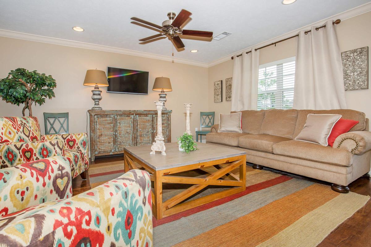 a living room filled with furniture and a fireplace