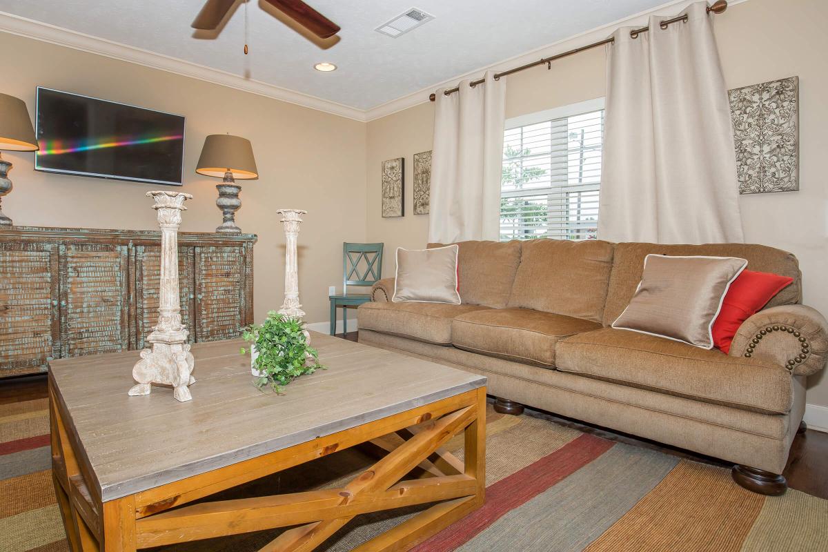 a living room filled with furniture and a fireplace