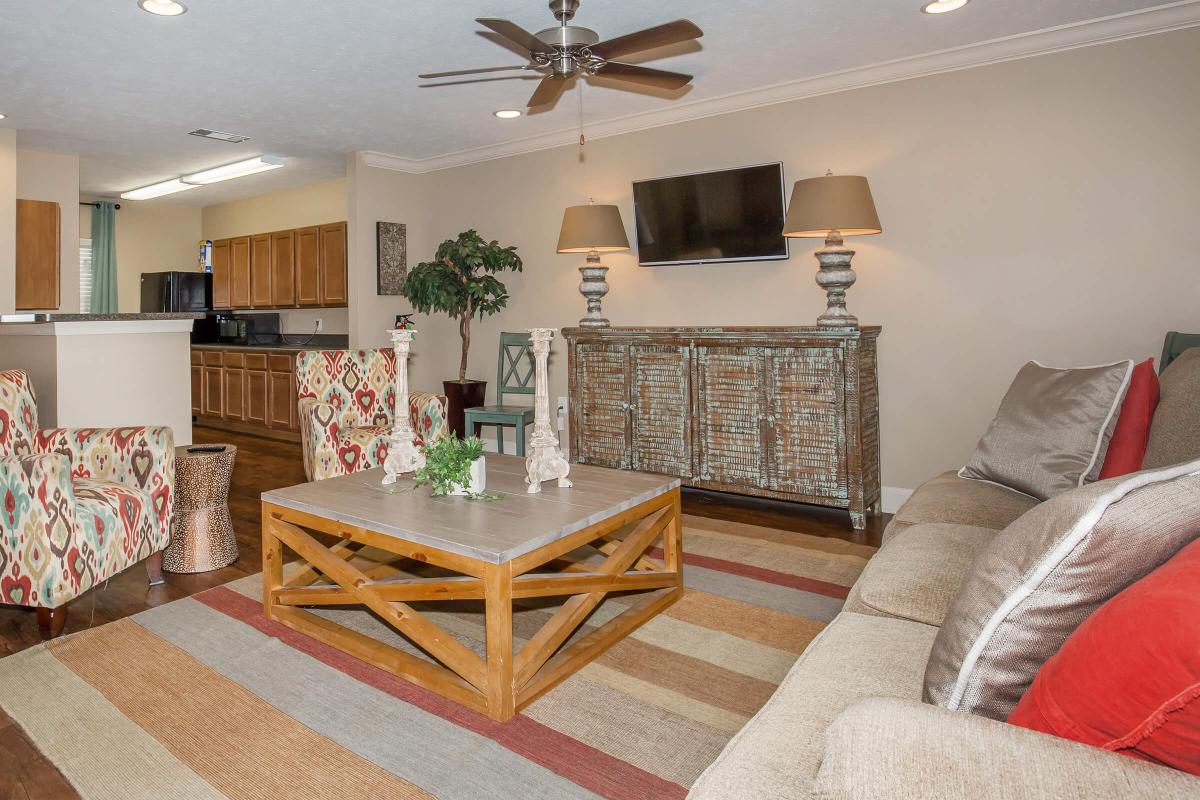 a living room filled with furniture and a fireplace