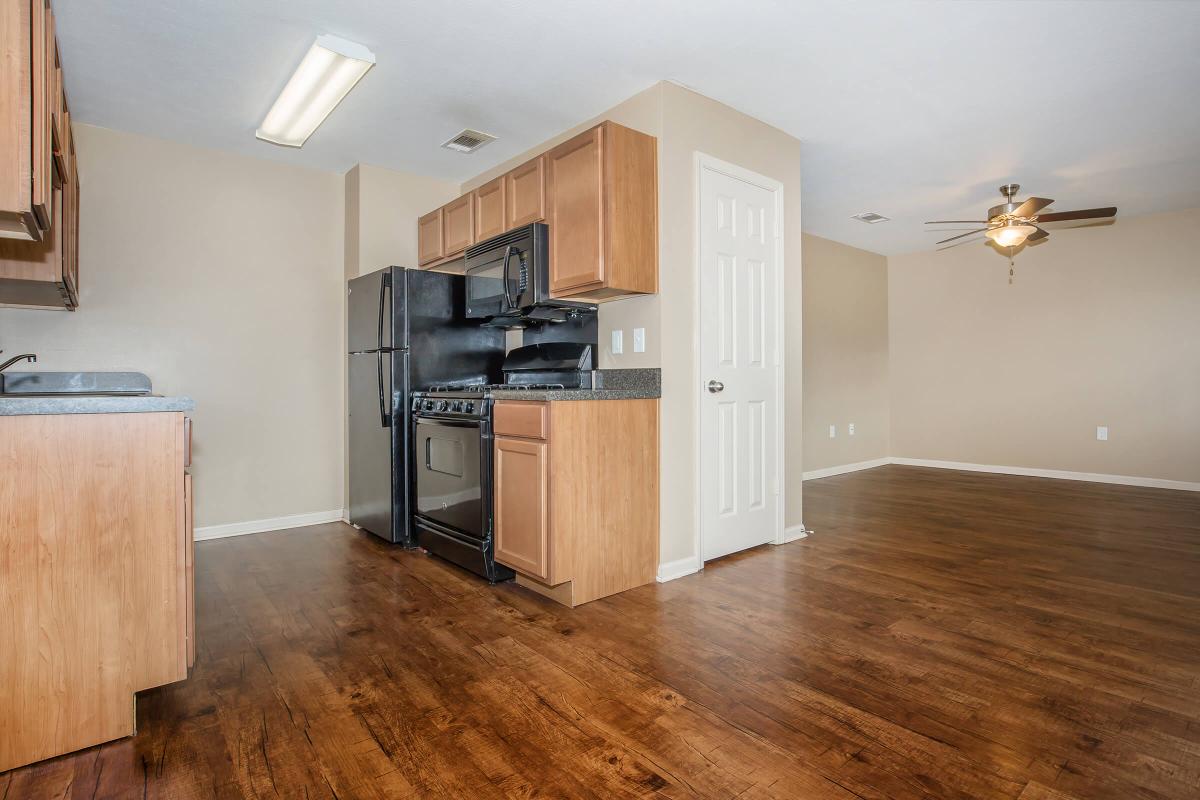 a kitchen with a wood floor