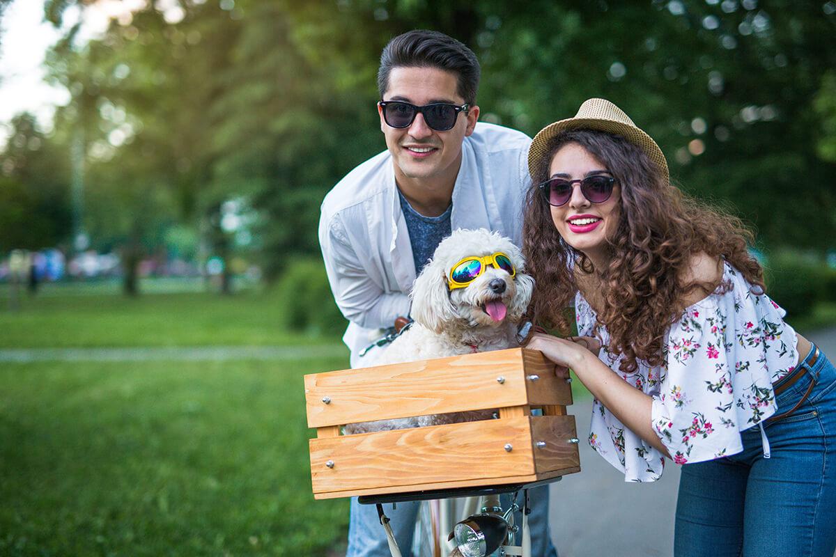 a person holding a bird in a park