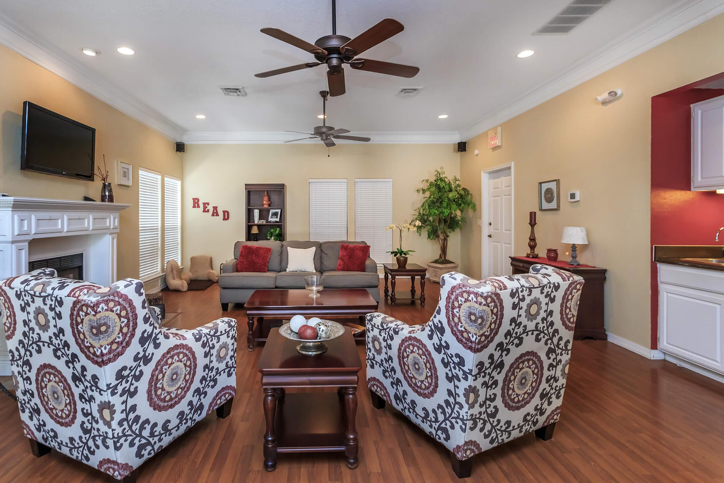 a living room filled with furniture and a fireplace