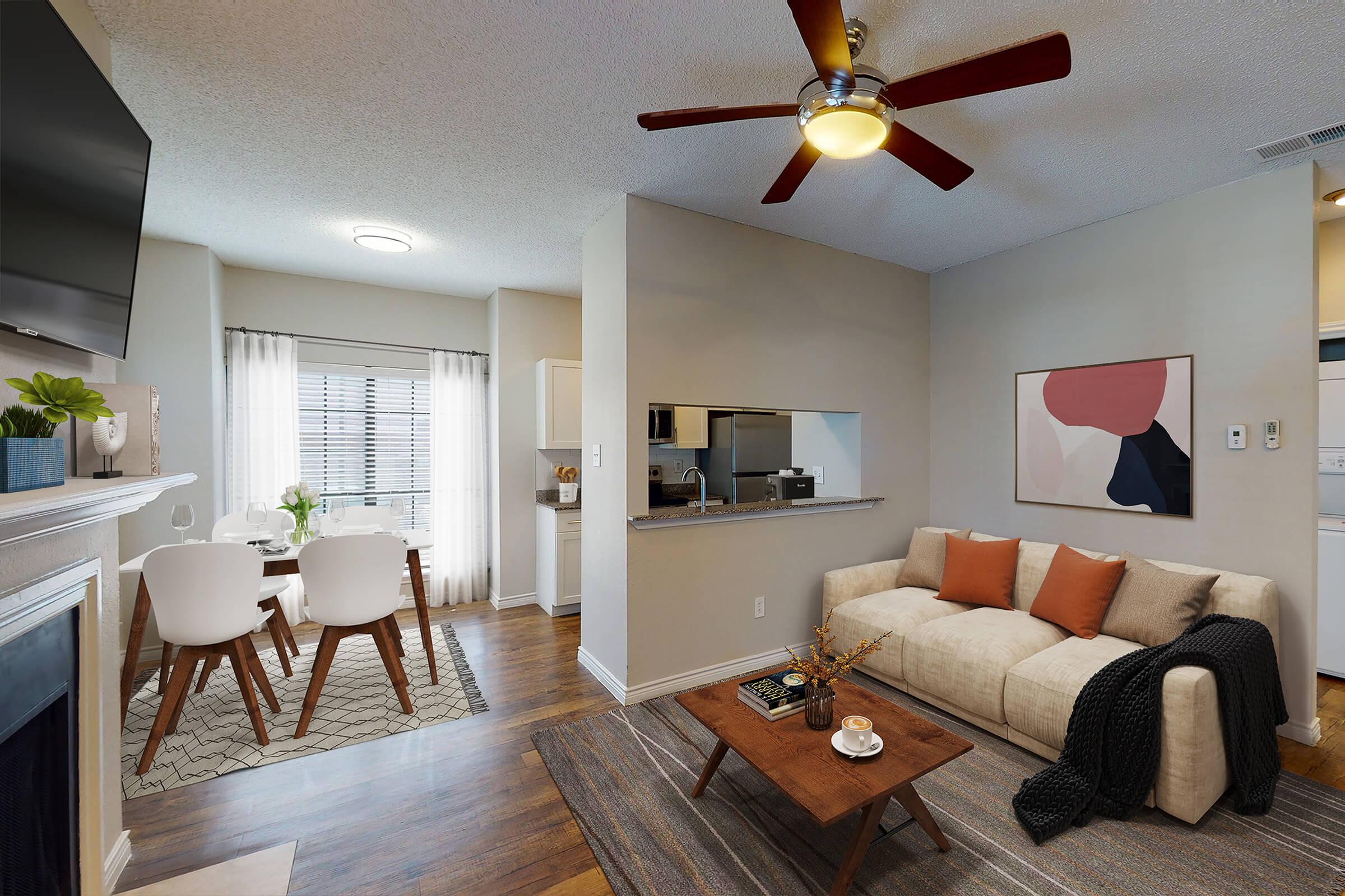 NICE LIVING ROOM WITH CEILING FANS AT PRIME AT LAKE HIGHLANDS APARTMENTS FOR RENT