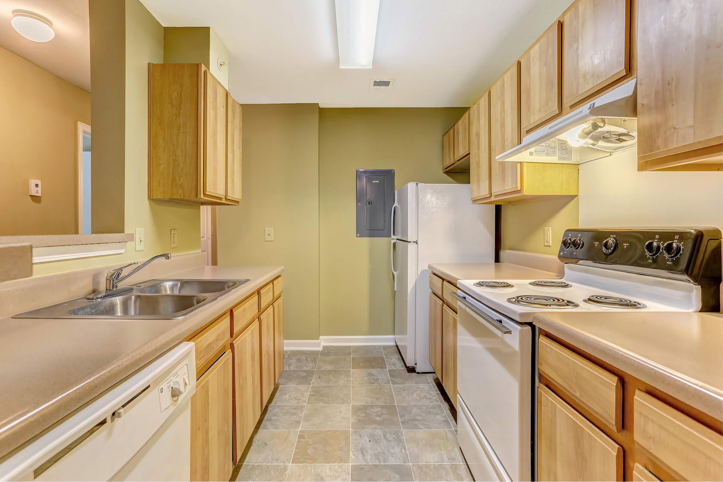 a kitchen with a stove and a sink