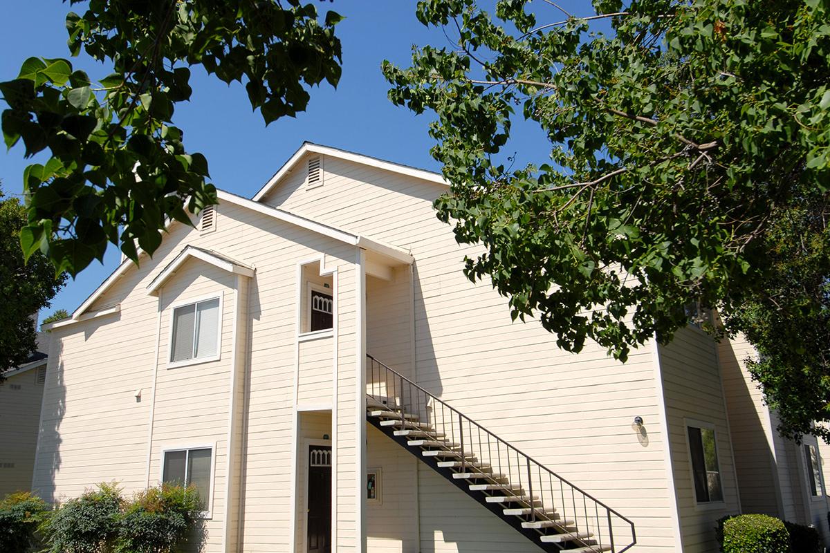 a small clock tower in front of a house