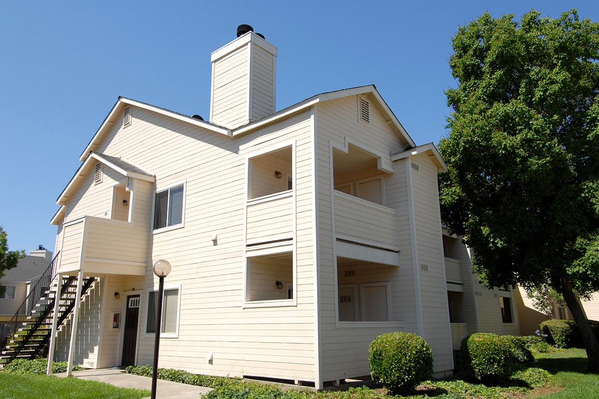 a small clock tower in front of a house