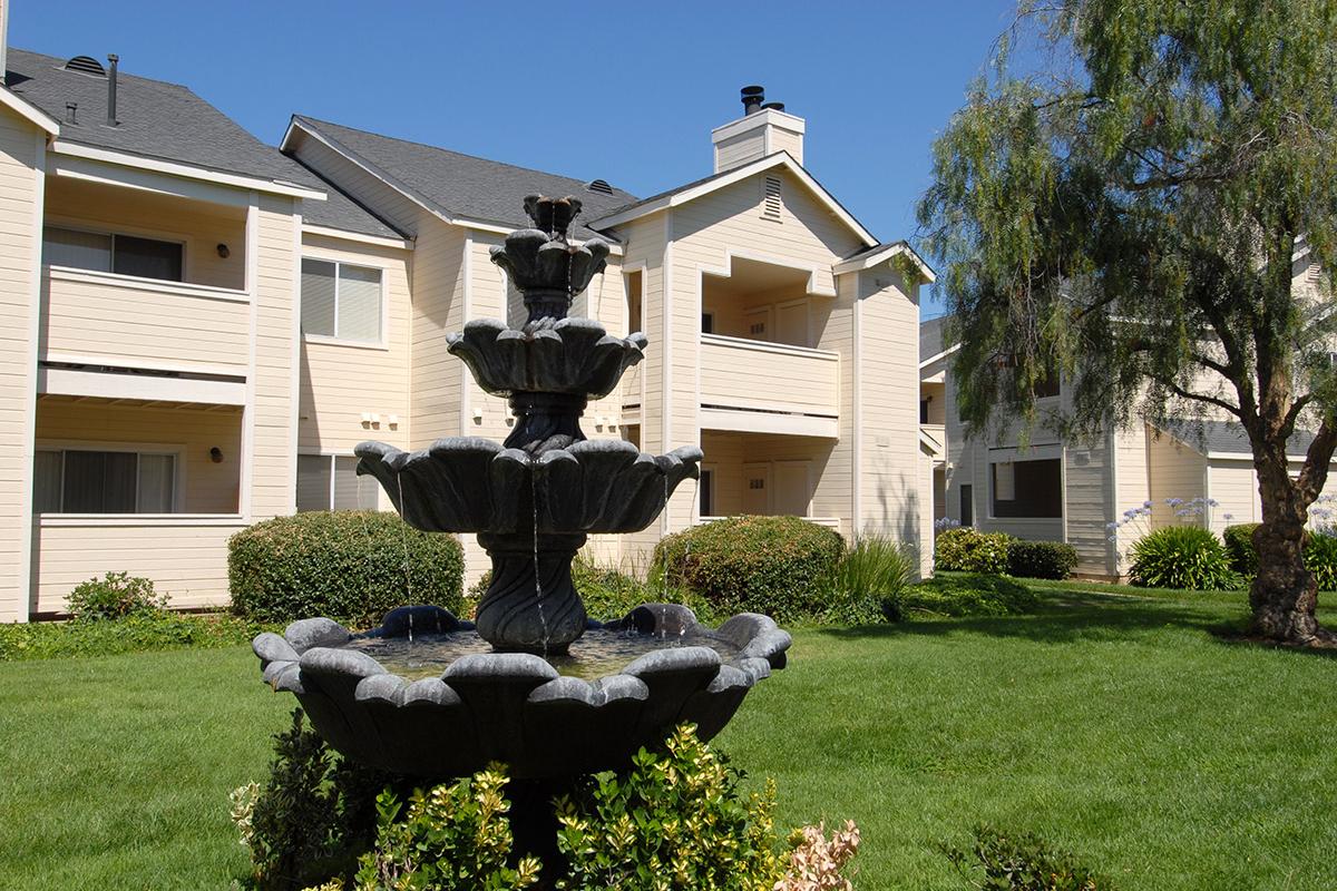 a statue in front of a house