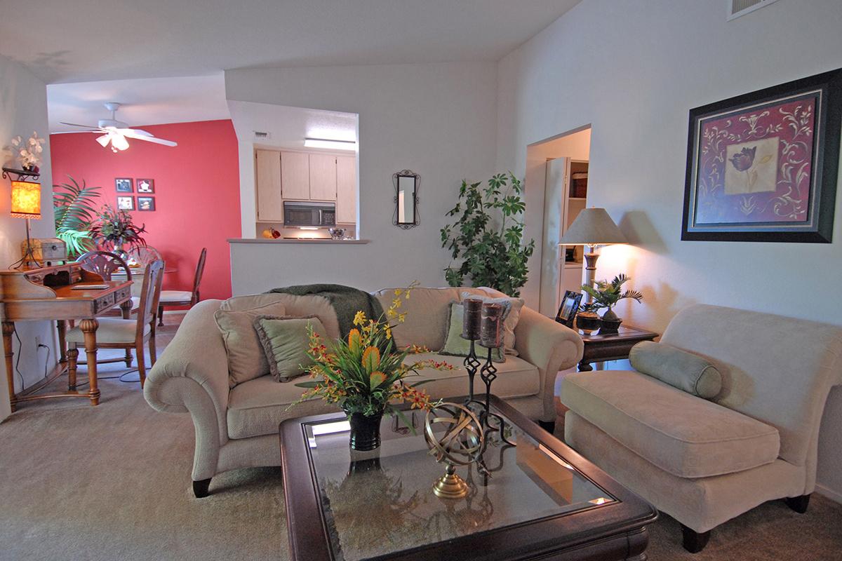 a living room filled with furniture and a fire place