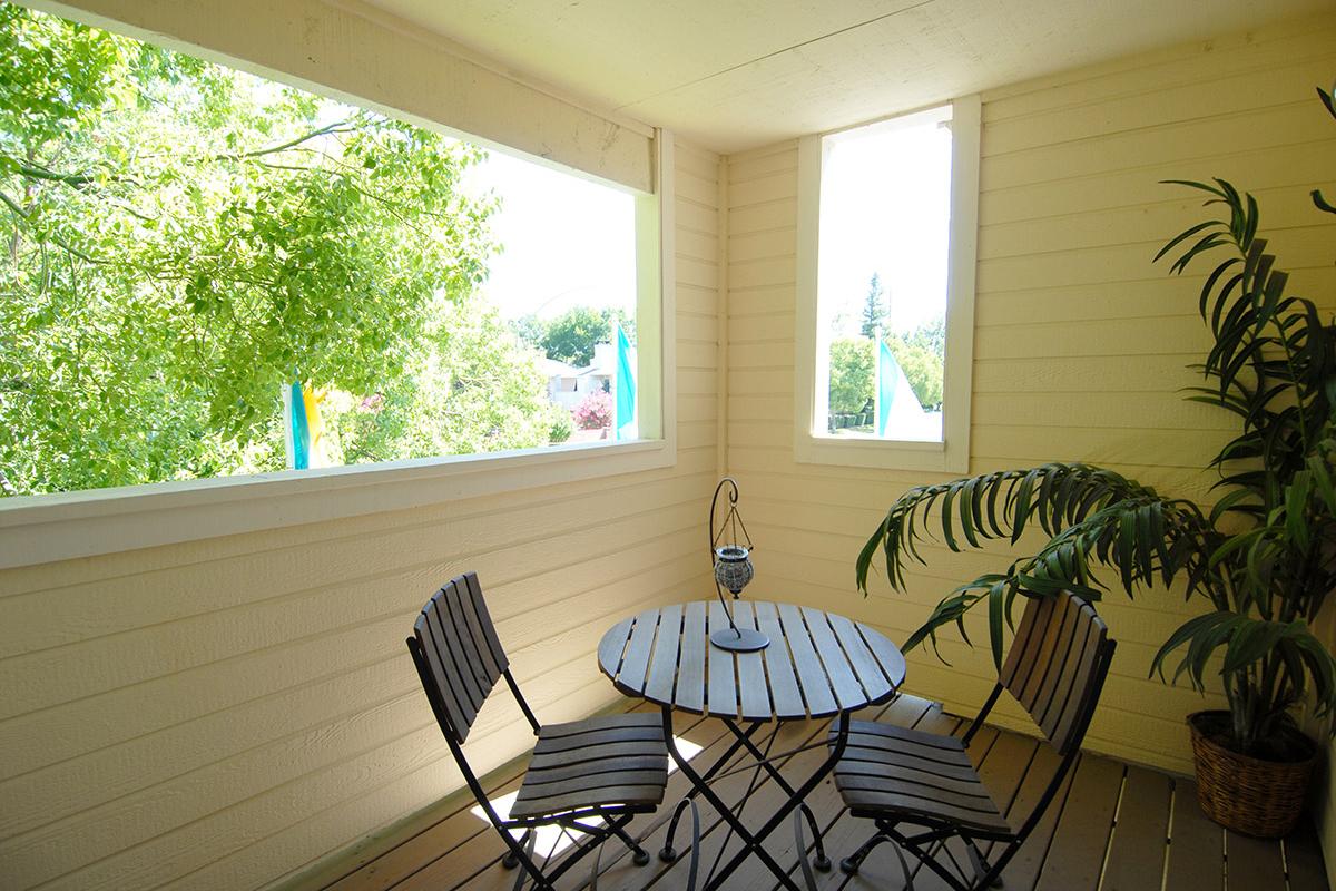 a dining room table in front of a window