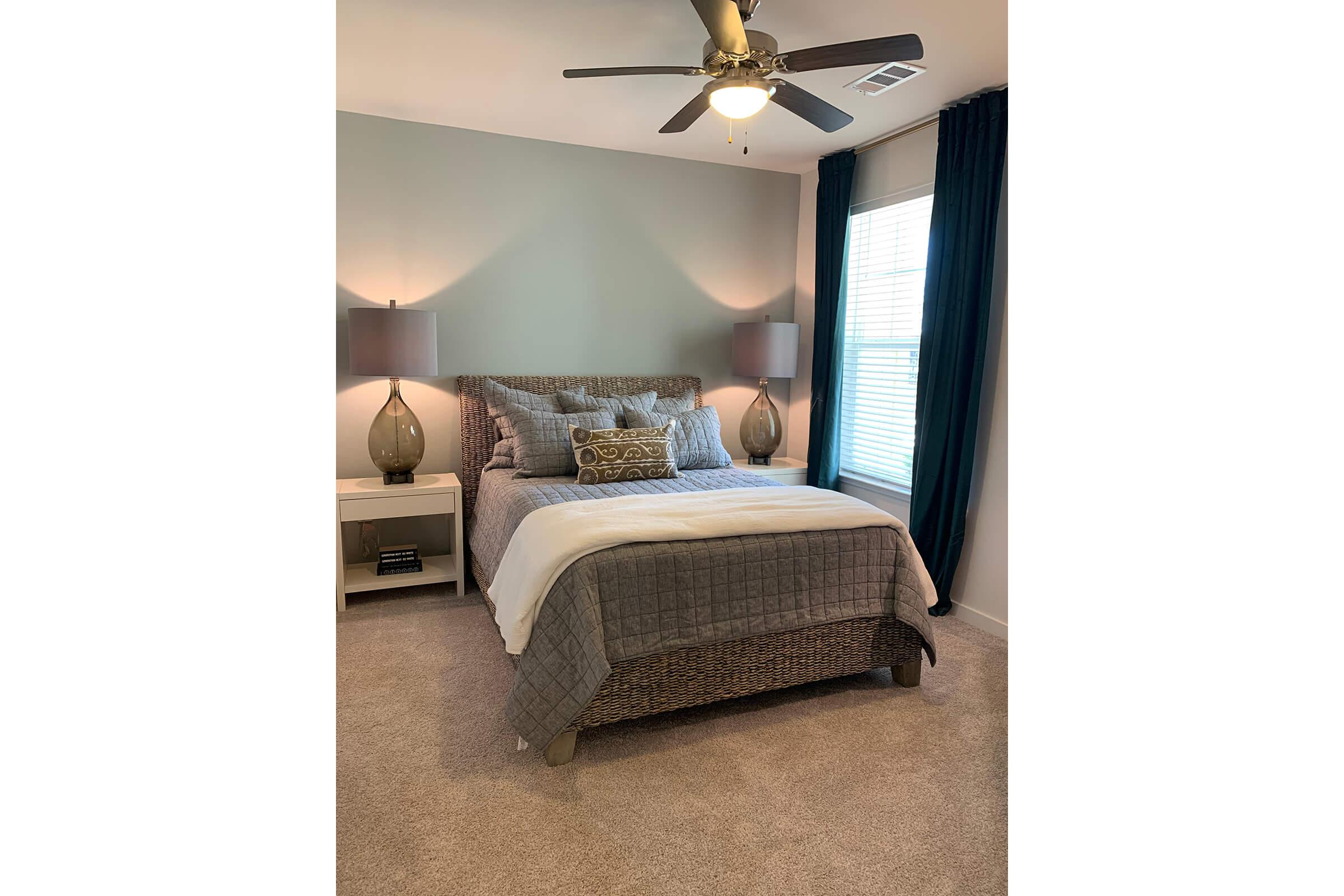a bedroom with a bed in a room