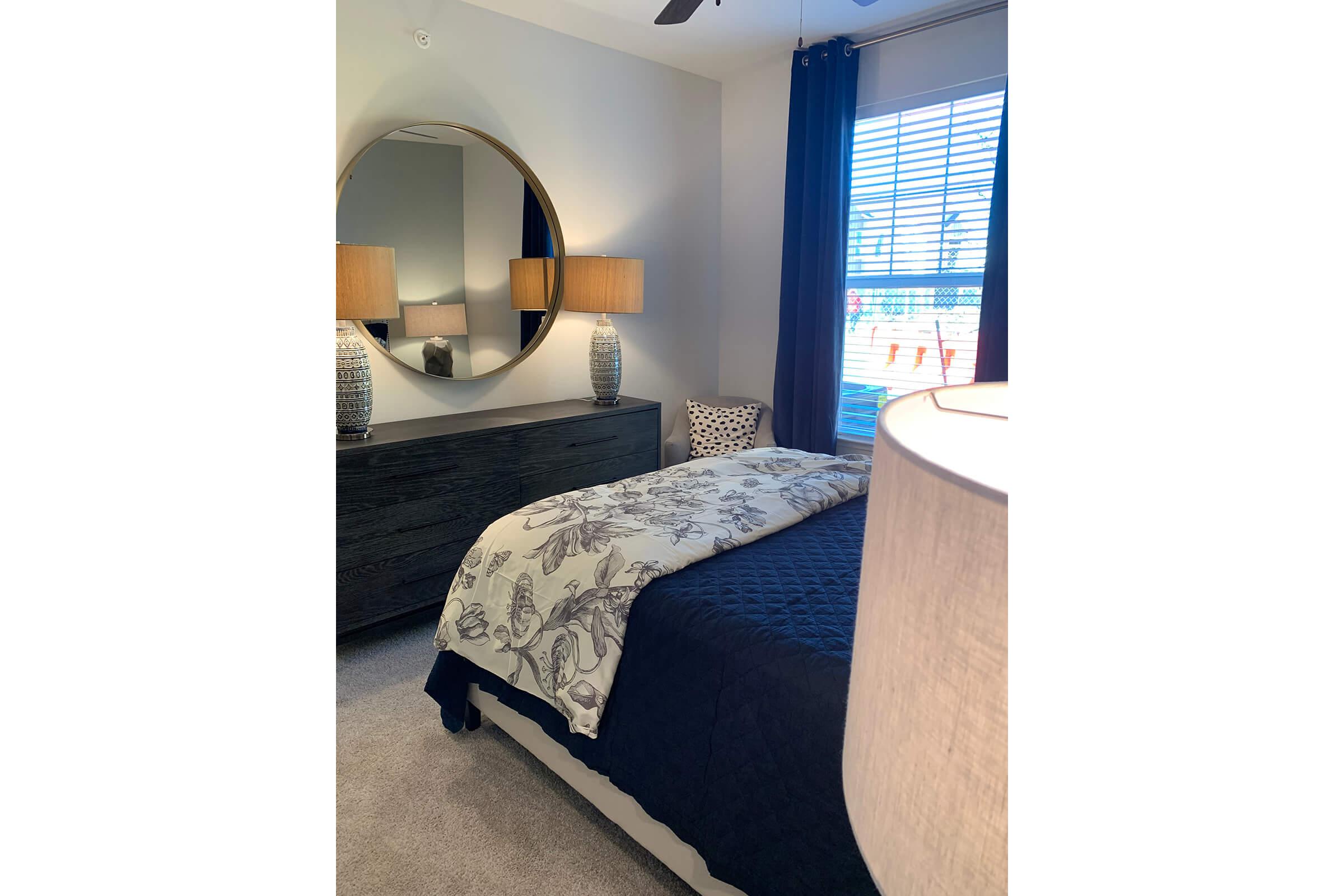 a bedroom with a bed in a room