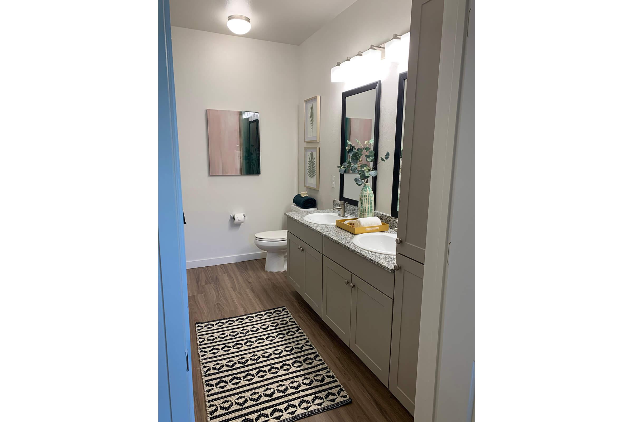 a room with a sink and a mirror