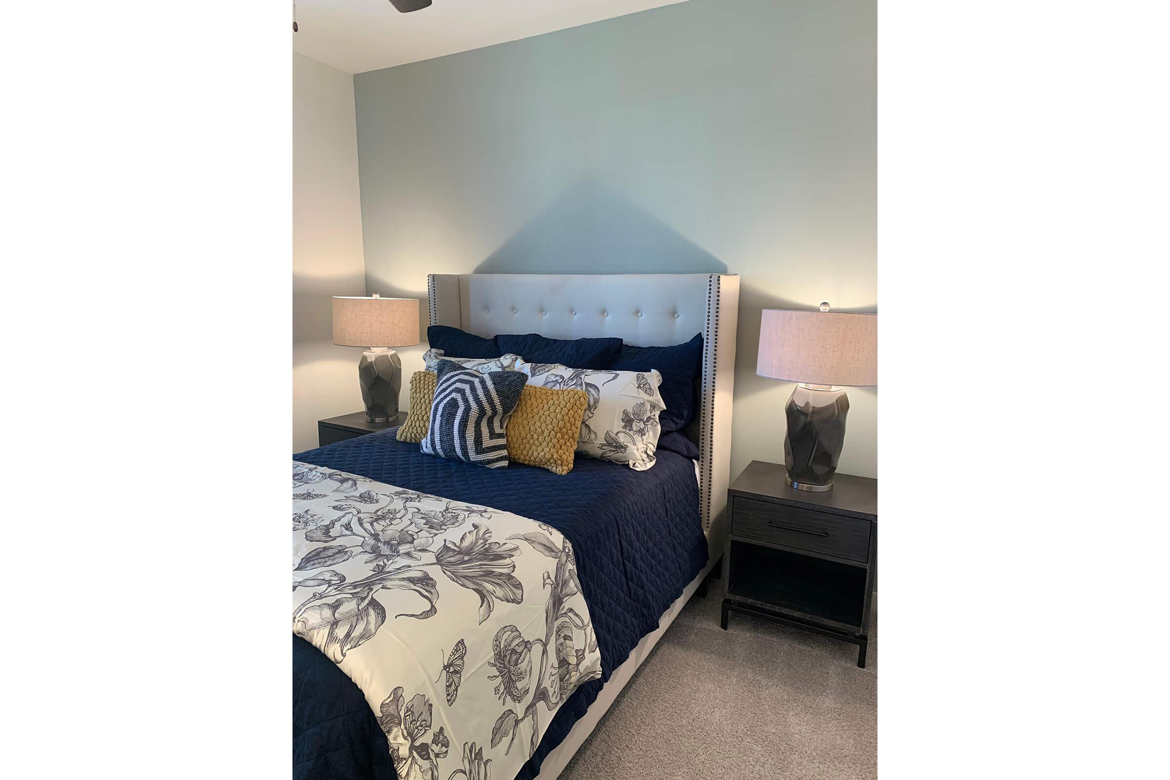 a bedroom with a bed in a room
