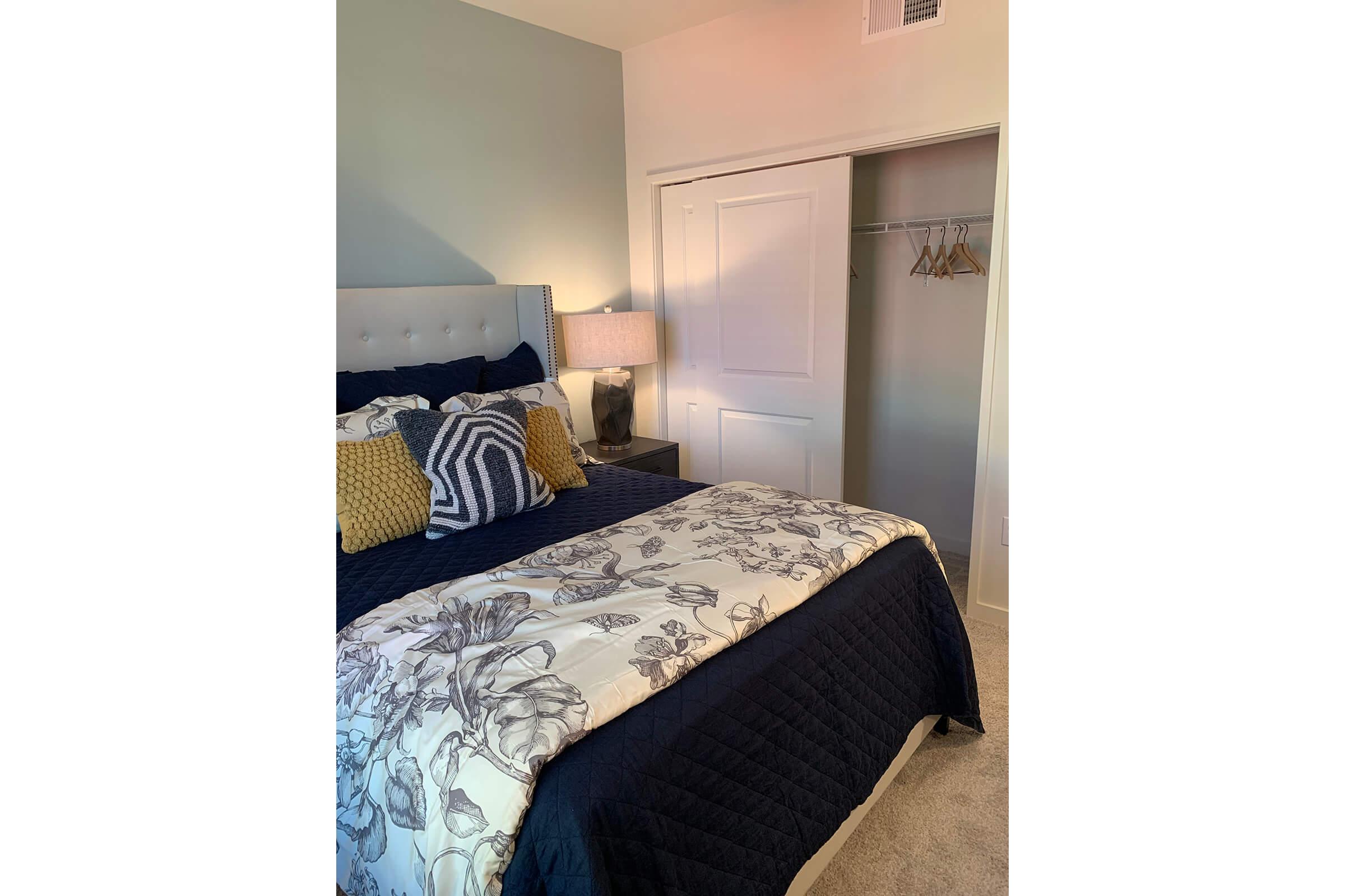 a bedroom with a bed in a room