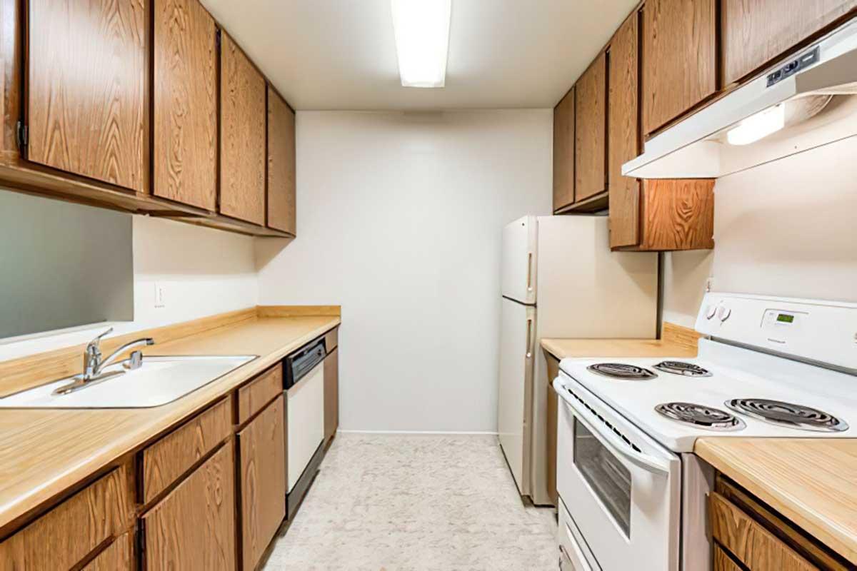 a kitchen with a stove and sink 