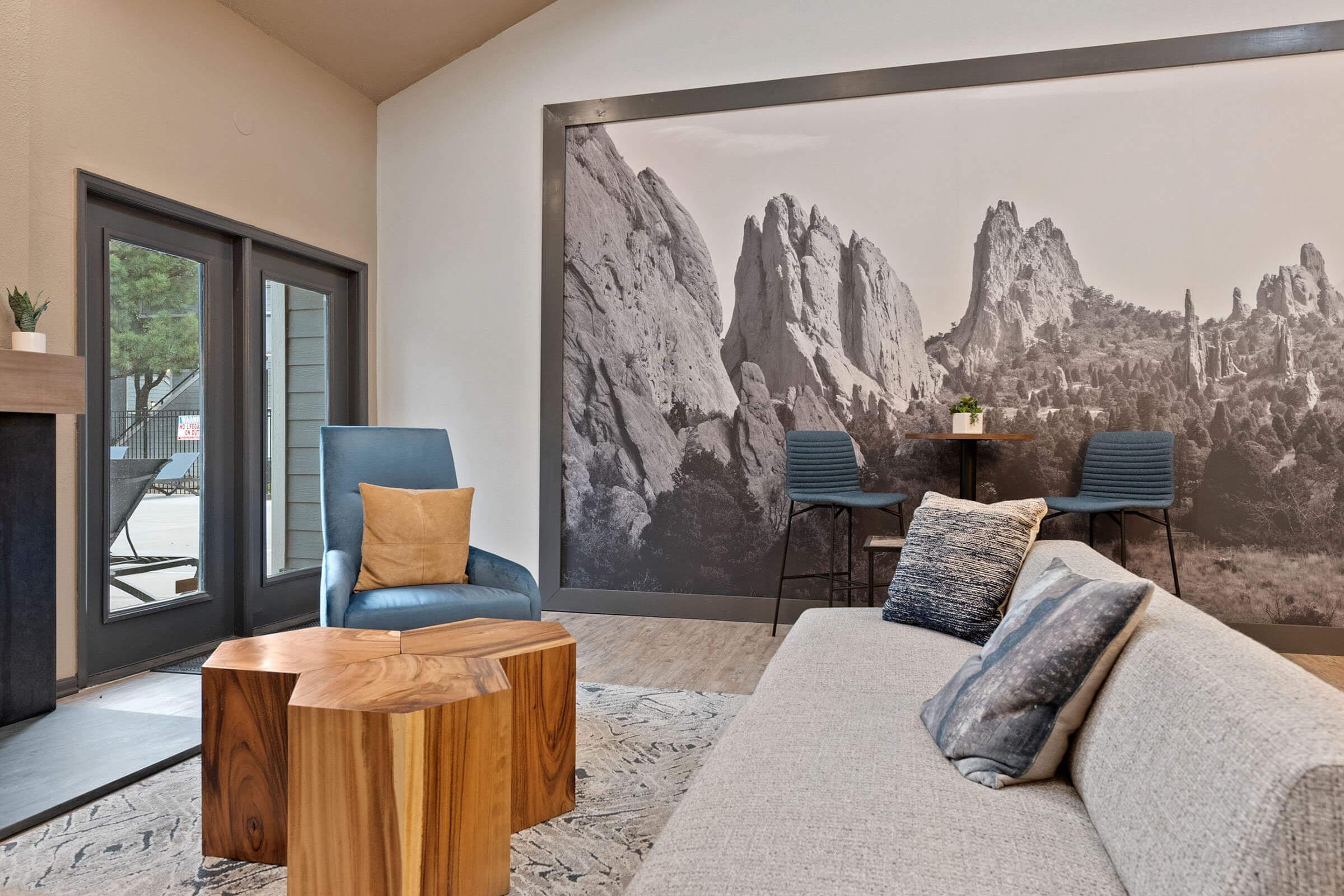 a living room with a stone wall