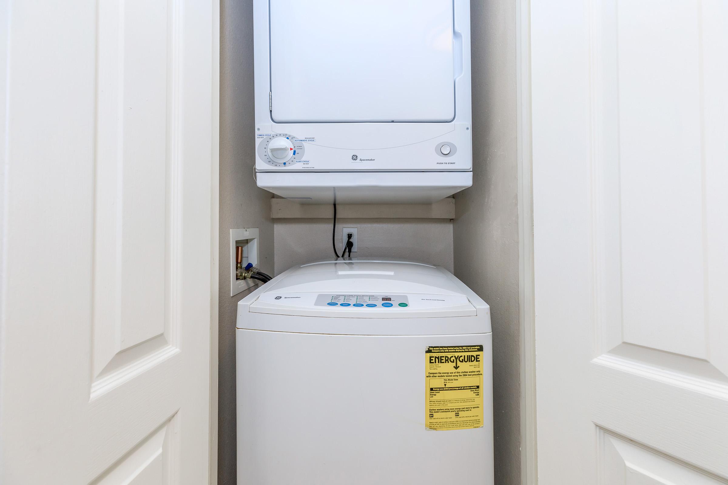 a microwave oven sitting on top of a refrigerator