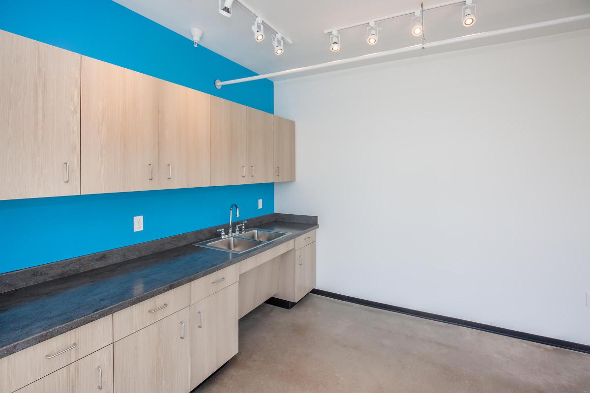 a kitchen with wooden cabinets