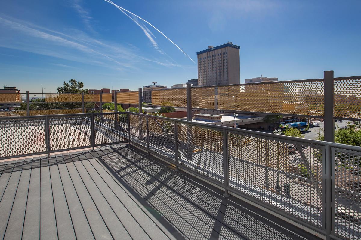 a bridge over a metal fence