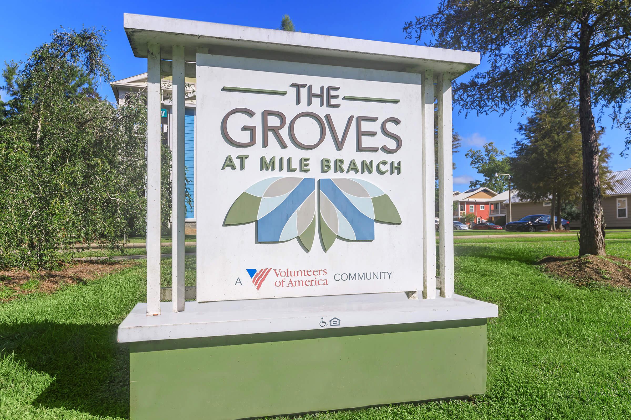 a large lawn in front of a sign