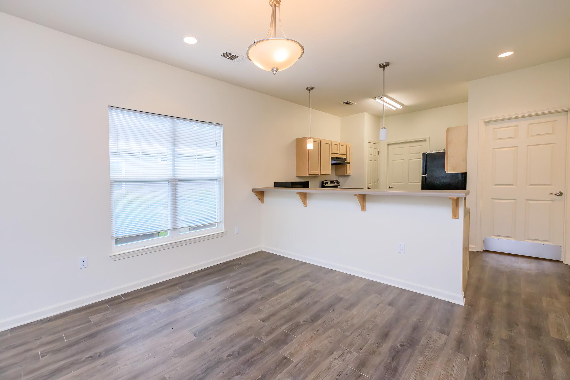 a kitchen with a wood floor