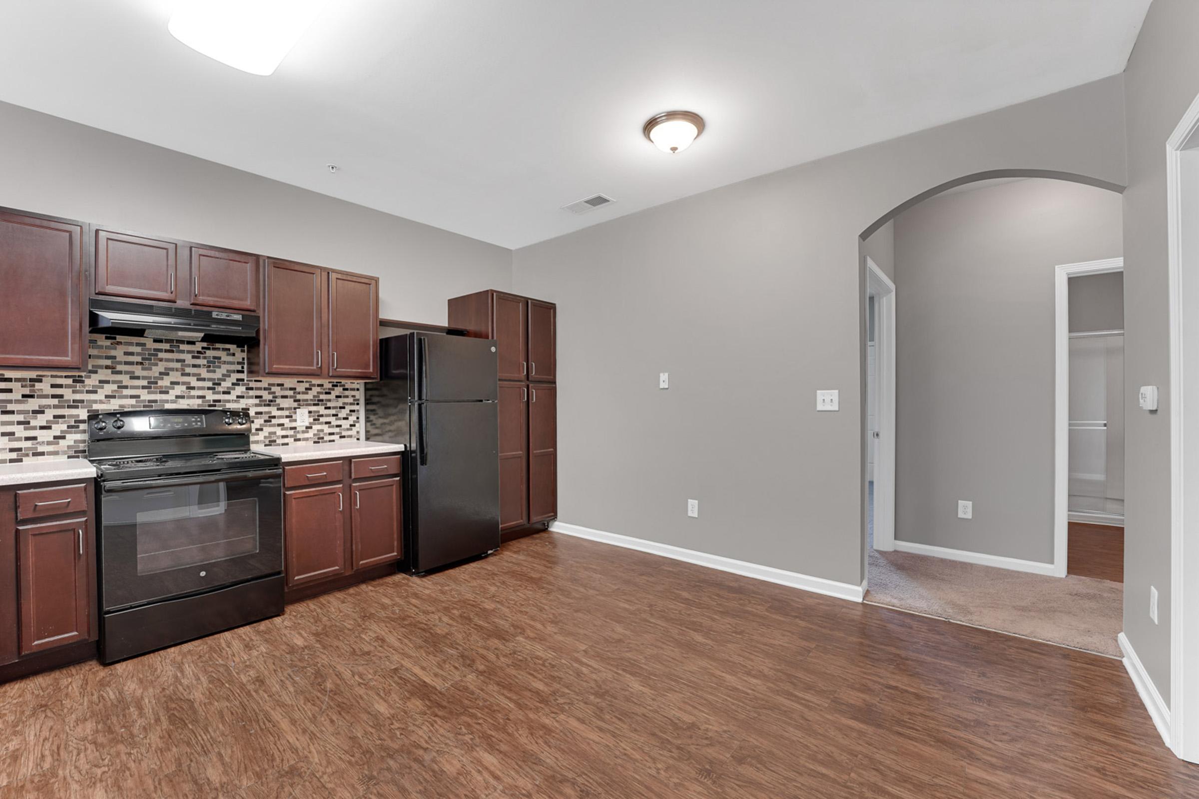 a kitchen with a wood floor