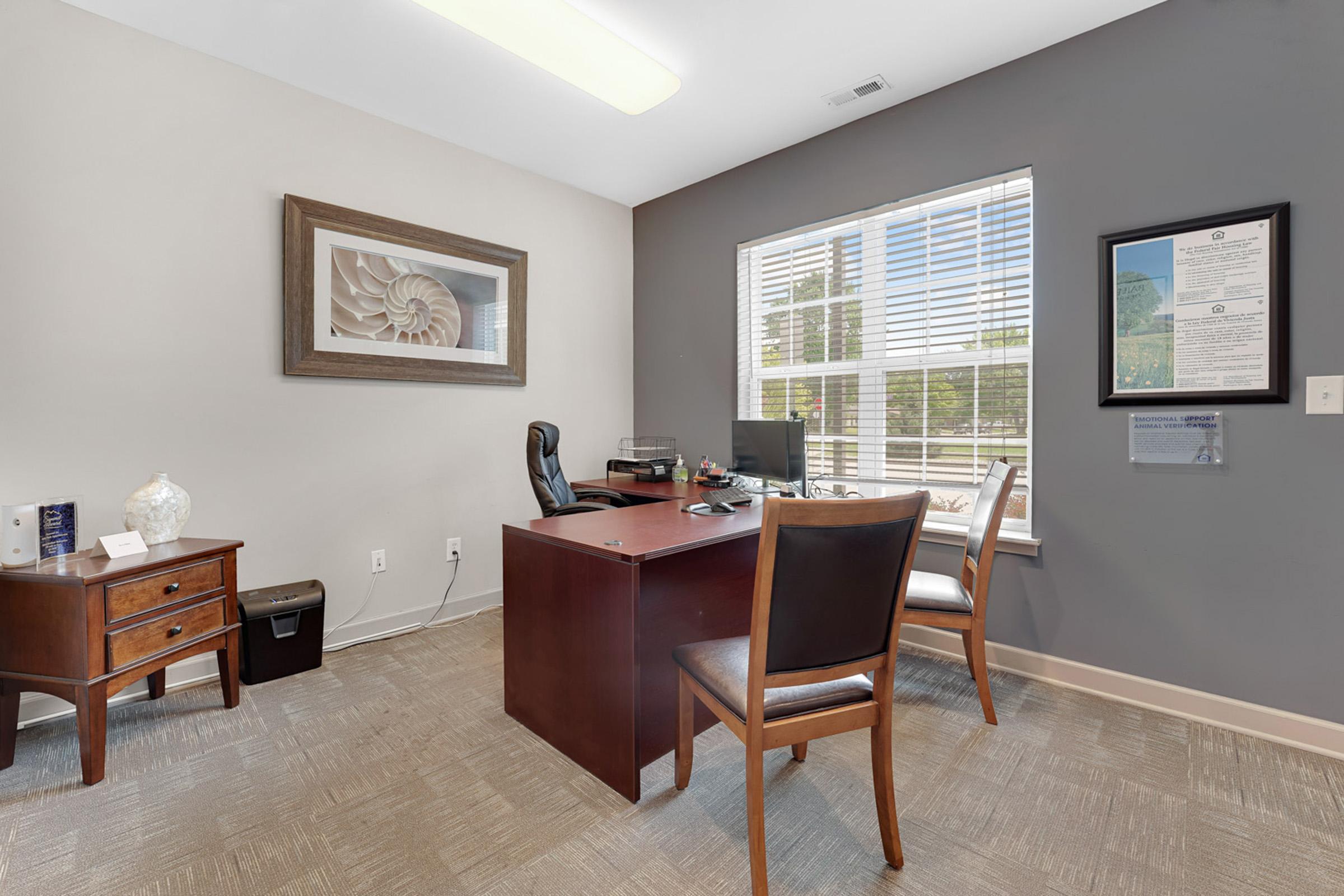 a living room filled with furniture and a large window