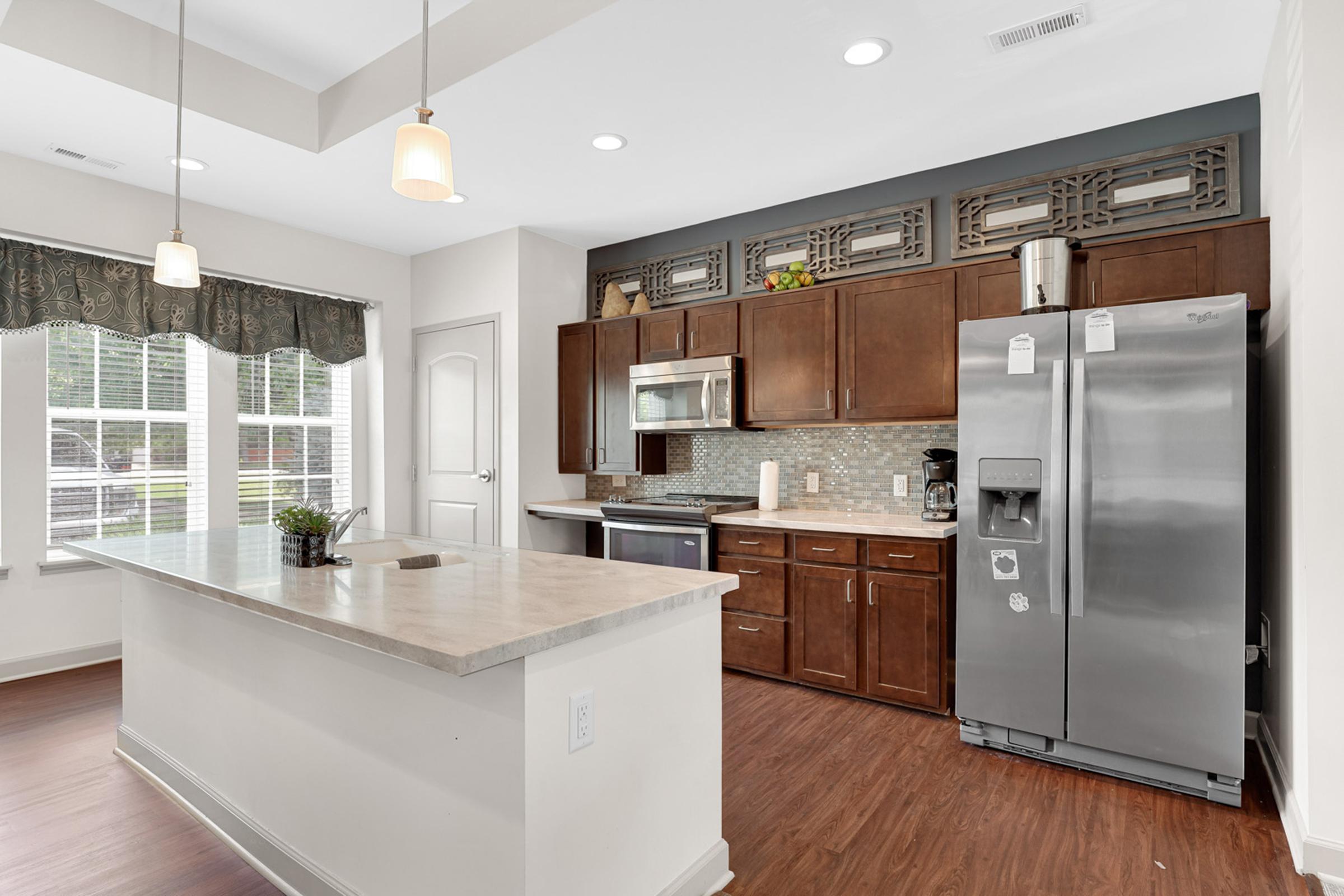 a large kitchen with stainless steel appliances