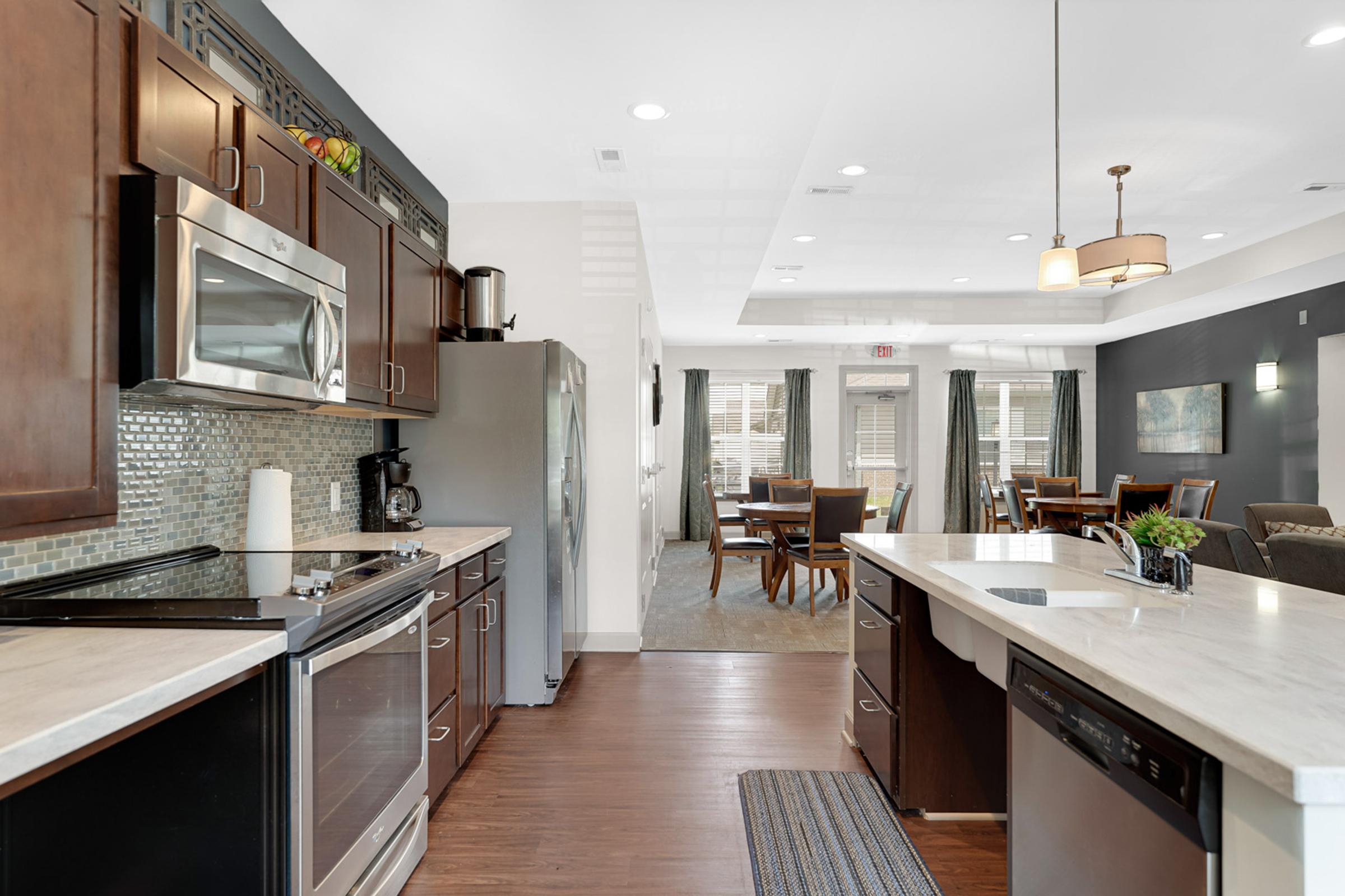 a modern kitchen with an island in the middle of a room